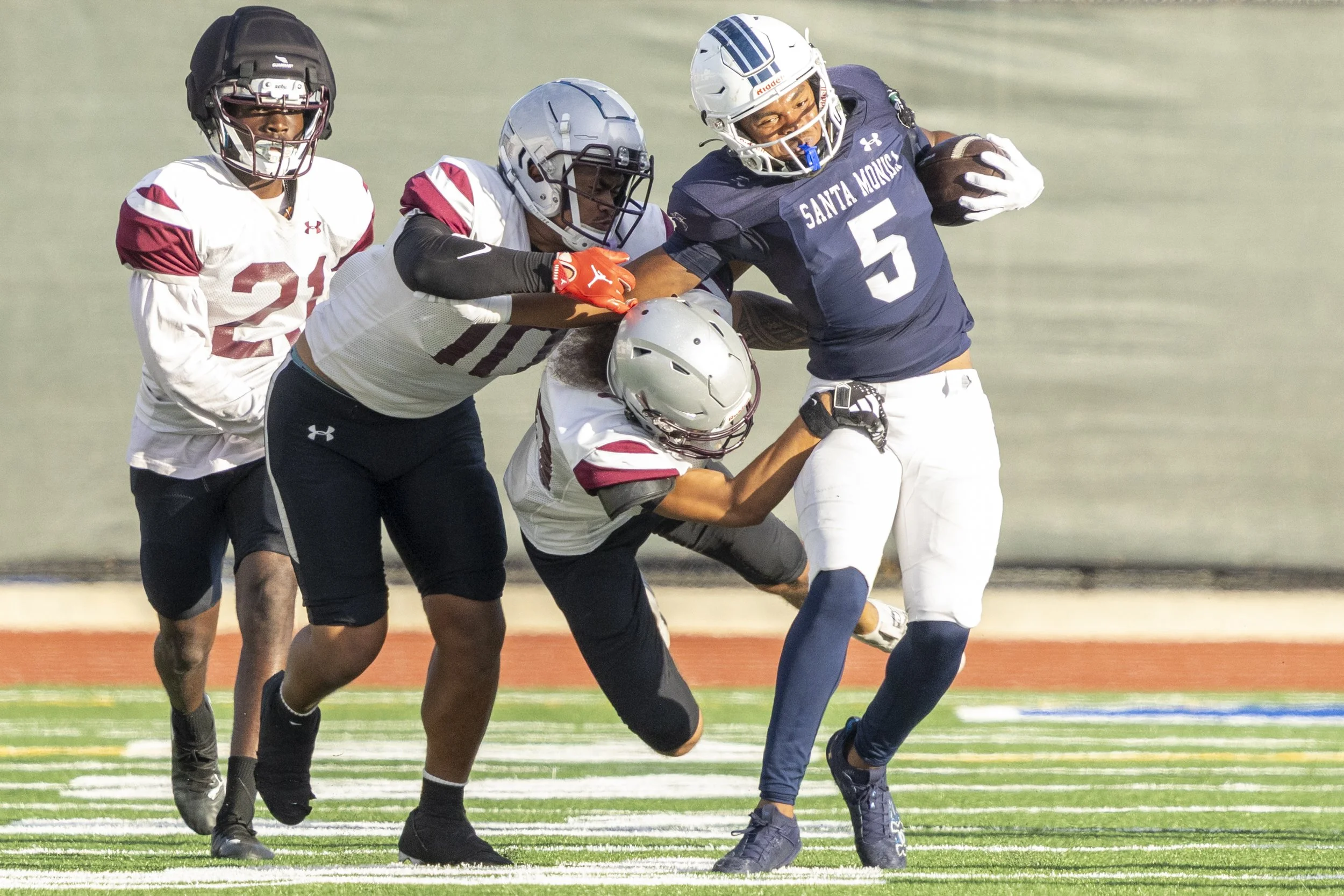  Santa Monica College (SMC) Men’s Football Corsair and running back Dylan Franklin (5), runs with the ball as Compton College Coyotes tackle him during their game on Saturday, Sept. 5, 2026, at the SMC Corsair Field in Santa Monica, Calif. The Corsai