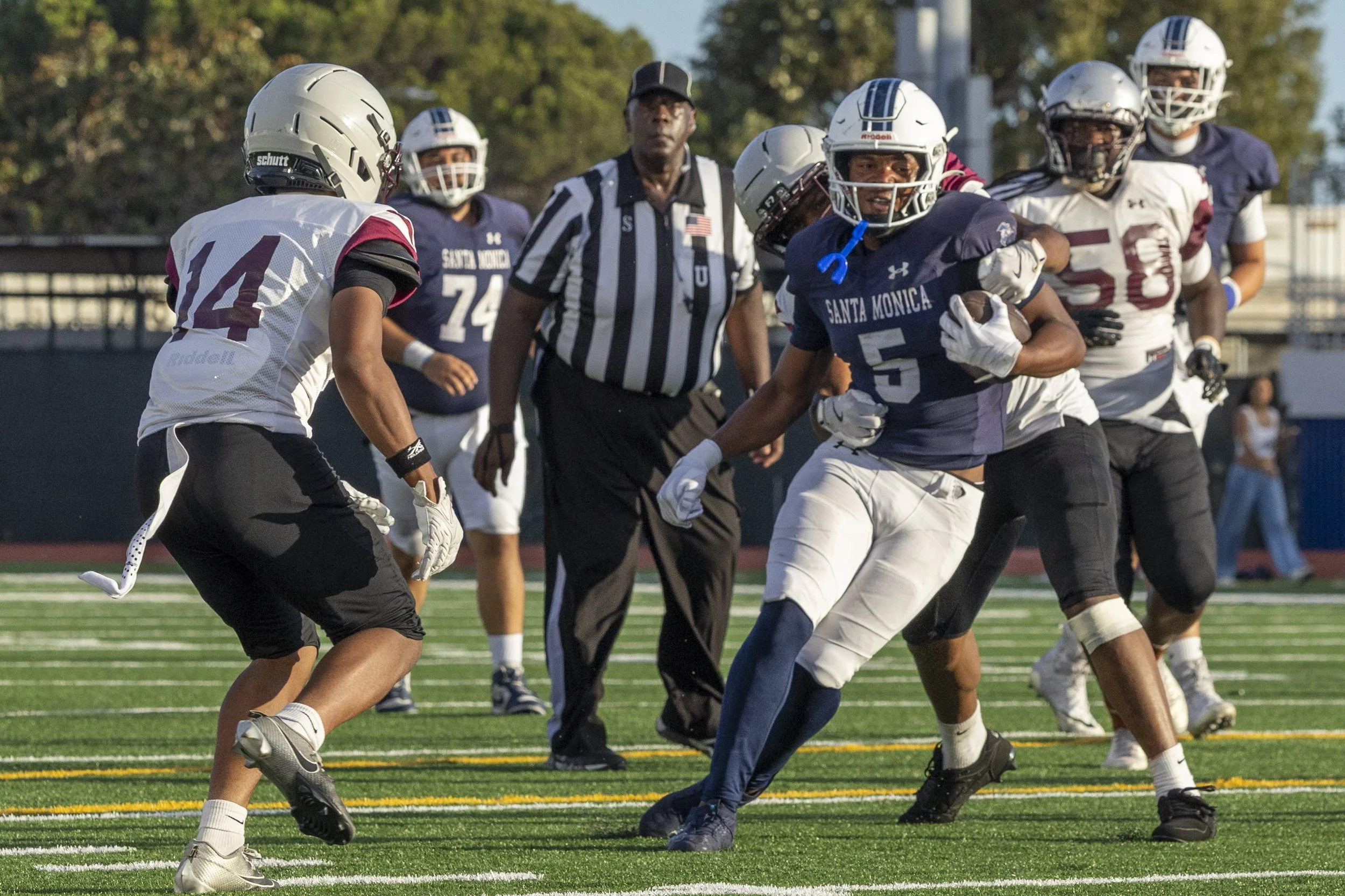  Santa Monica College (SMC) Men’s Football Corsair and running back Dylan Franklin (5), runs with the ball as Compton College Coyotes tackle him during their game on Saturday, Sept. 5, 2026, at the SMC Corsair Field in Santa Monica, Calif. The Corsai