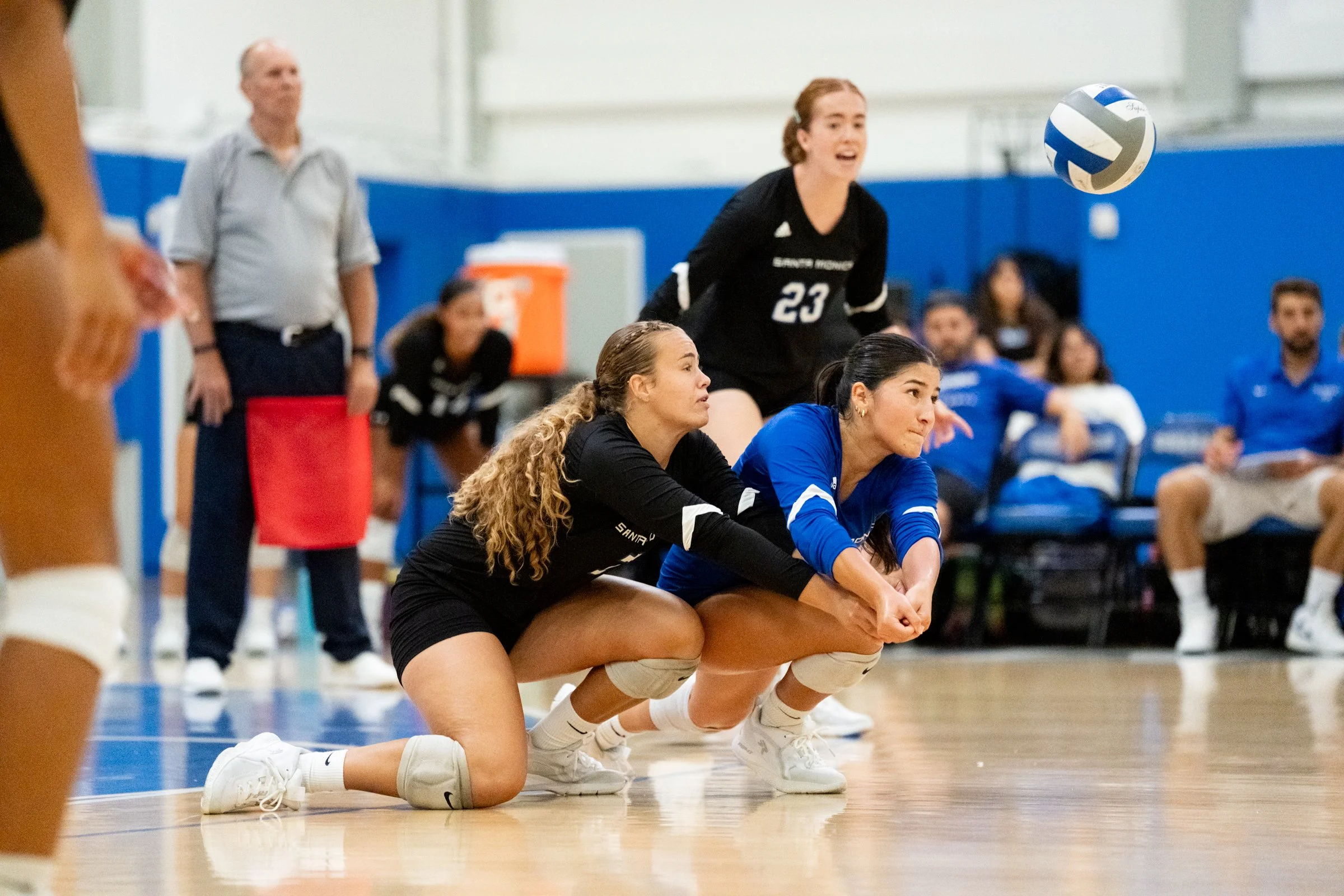 Santa Monica College (SMC) Corsairs Women’s Volleyball Libero Isabella Maria Aragon (11) (left) and Setter/Libero Emersyn Angelina Ebel (7) (right) with a serve receive during a game against Orange Coast Pirates in Santa Monica, California on Friday