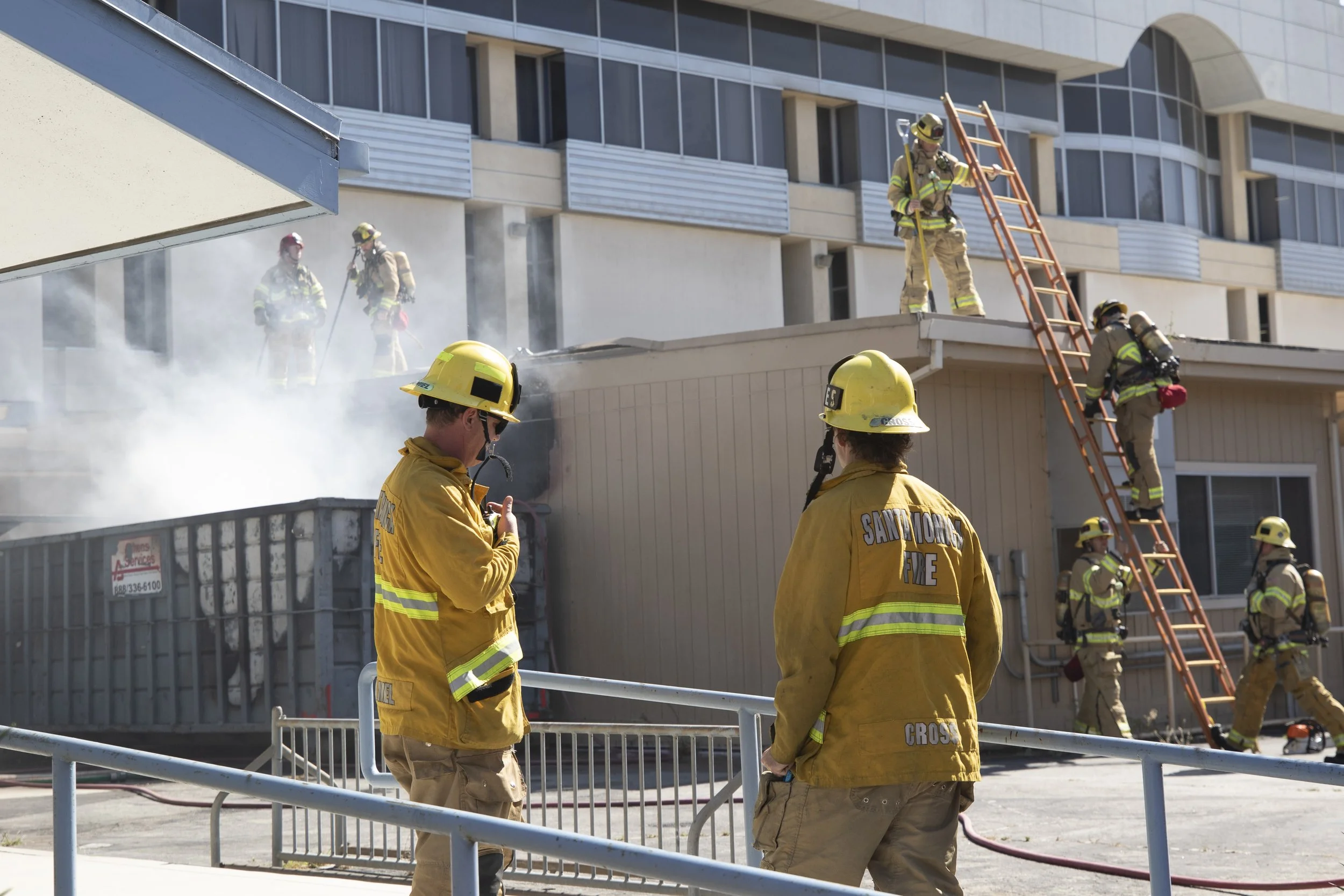  Fire Fighters climb to the roof of a temporary building to extinguish a dumpster fire that ignited at Santa Monica College's main campus at around 2:45 Thursday, September 17, 2026. Police arrived about five to ten minutes later along with fire figh