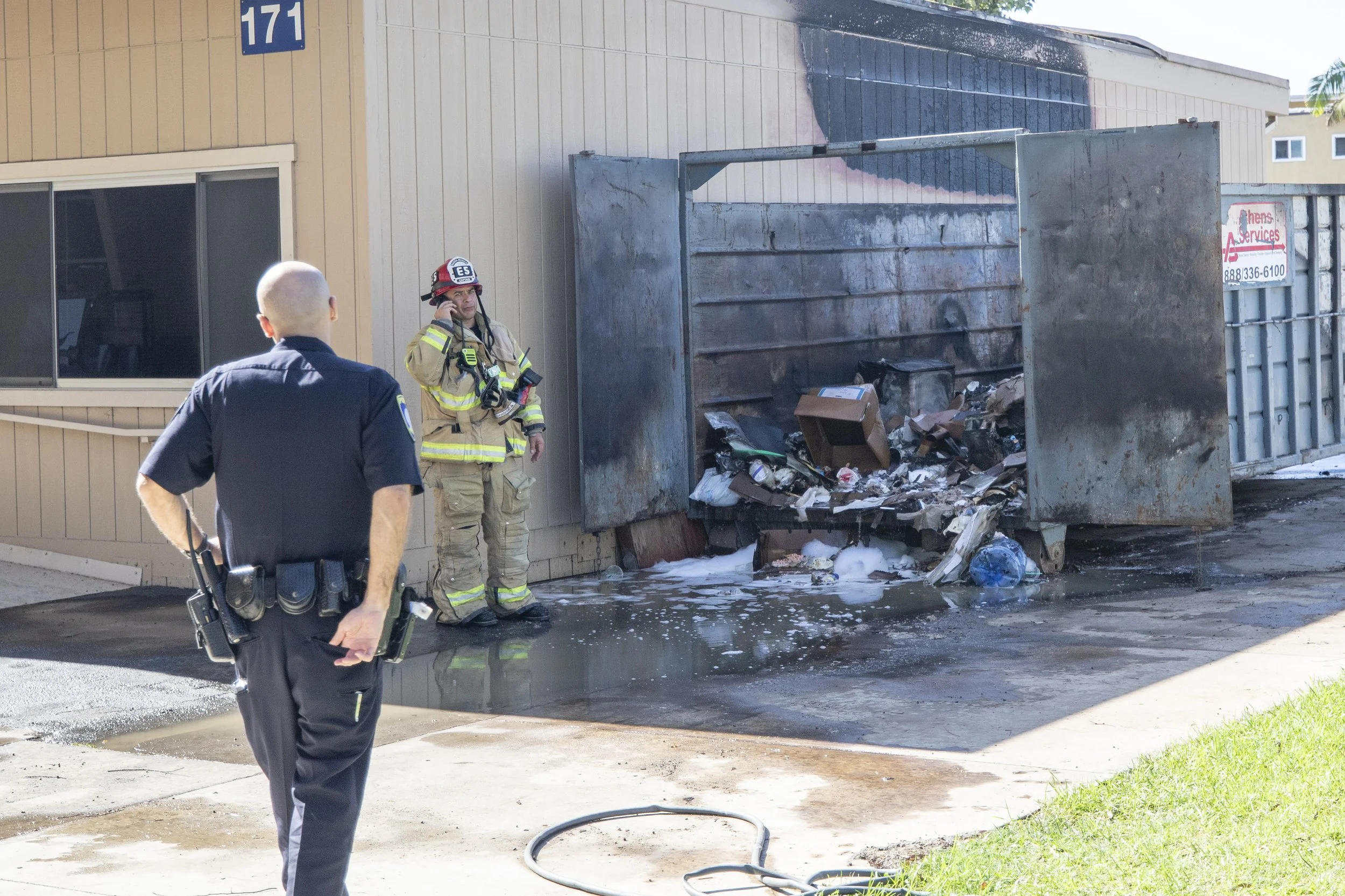 Investigators examine the dumpster ignited next to Drescher Hall at Santa Monica College's main campus at around 2:45 Thursday, September 17, 2026. Police arrived about five to ten minutes later along with fire fighters. The blaze was speculated by 