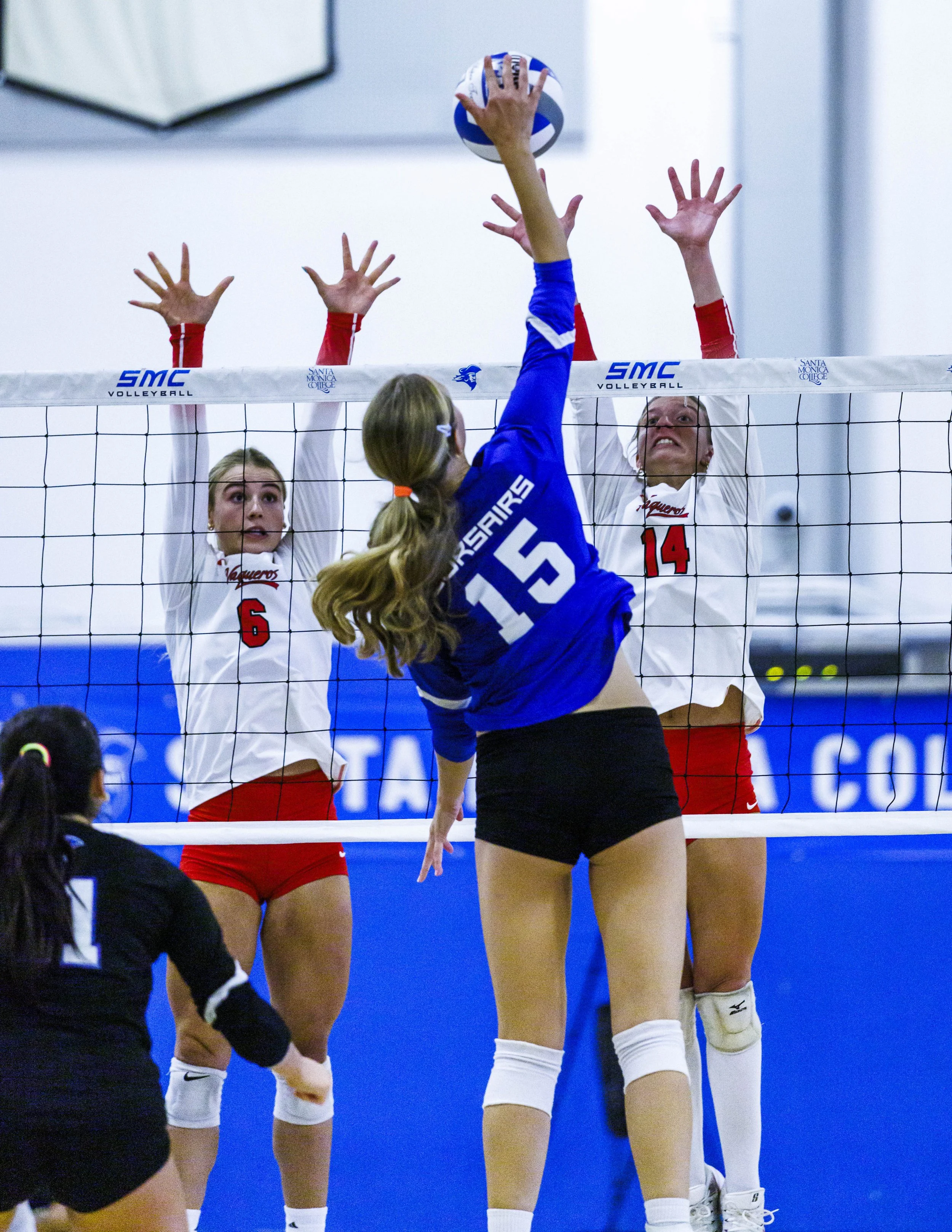  Santa Monica College (SMC) Corsairs Alison Cumming (15) (Center) spikes the ball as  Santa Barbara City College Vaqueros Sophie Otte (6) (Left) and Aubrielle LaPointe (14) (Right) try to block it during their game on Wednesday, September 23, 2026, a