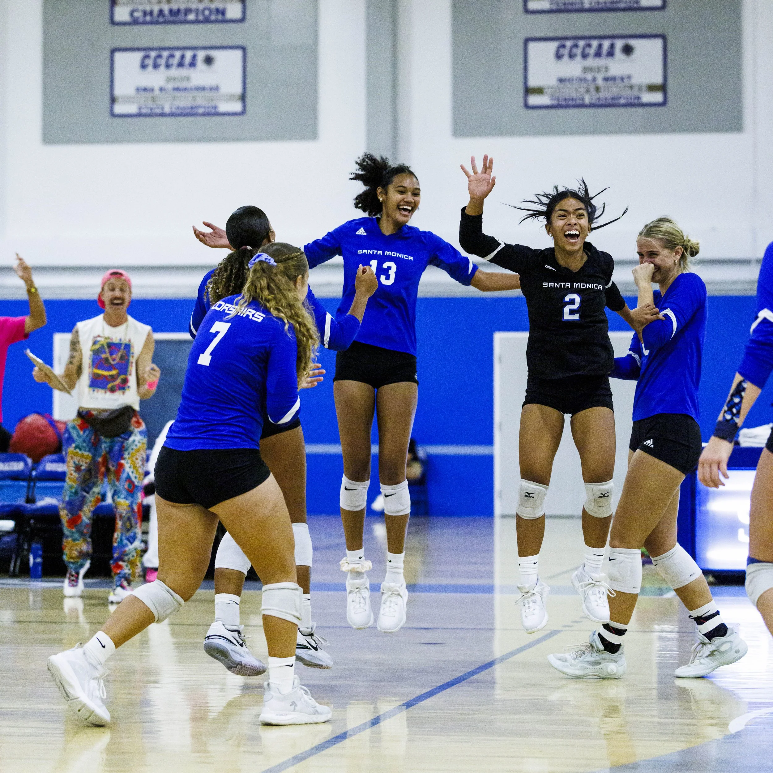  Santa Monica College (SMC) Corsairs players celebrate a point during their game against the Santa Barbara City College Vaqueros on Wednesday, September 23, 2026, at the SMC Corsair Gym in Santa Monica, Calif. The Corsairs defeated the Vaqueros 3 set