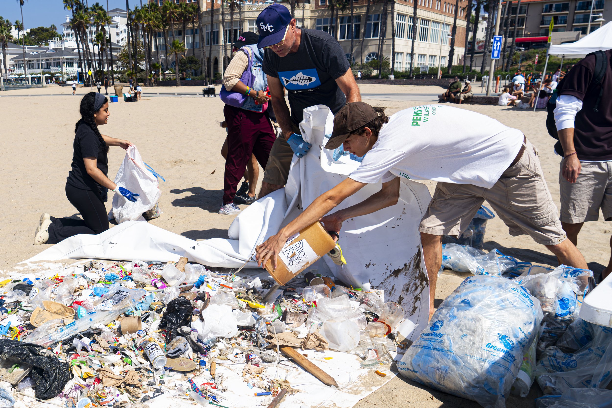  Site Captain of the coastal clean up & Santa Monica Sustainability Director Ferris Kawar & Sustainability member Gabriel Batener sort there the trash collected to determine what can and cannot be recycled before being disposed of properly at Santa M