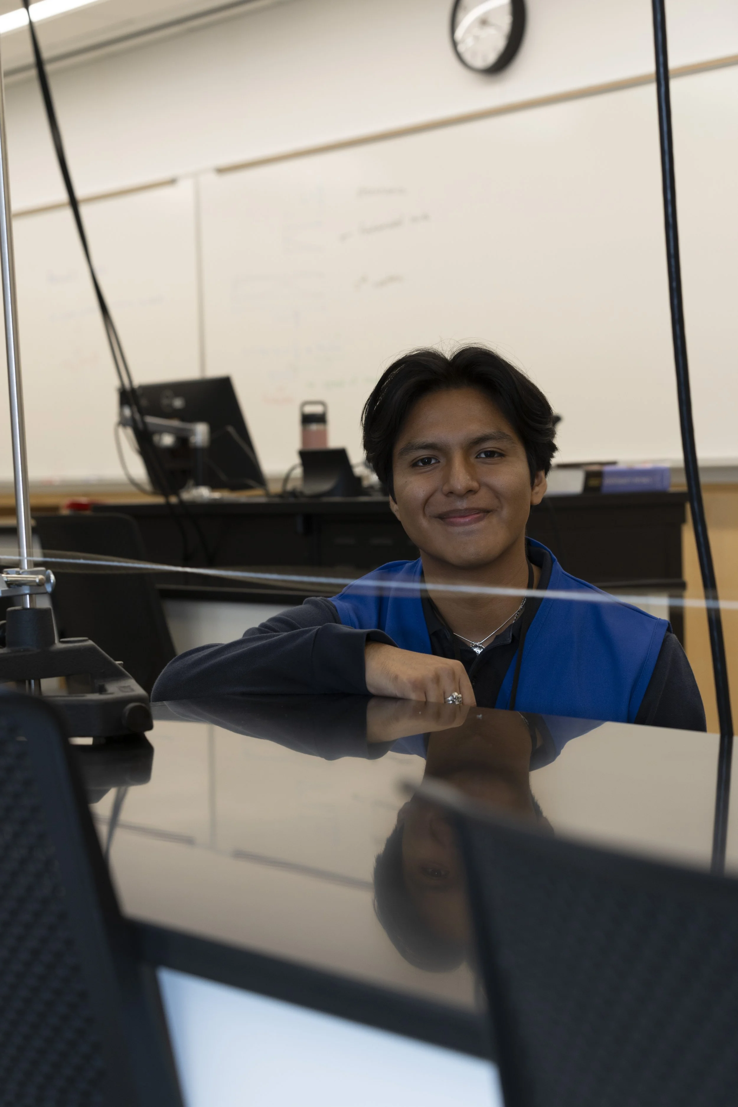  Daniel Castro Lopez (CQ), A Santa Monica College (SMC)  Mechanical Engineering student demonstrating a standing wave lab by showing how tension and frequencies influence node formations through a piece of string during the SMC STEM Fundraiser Launch