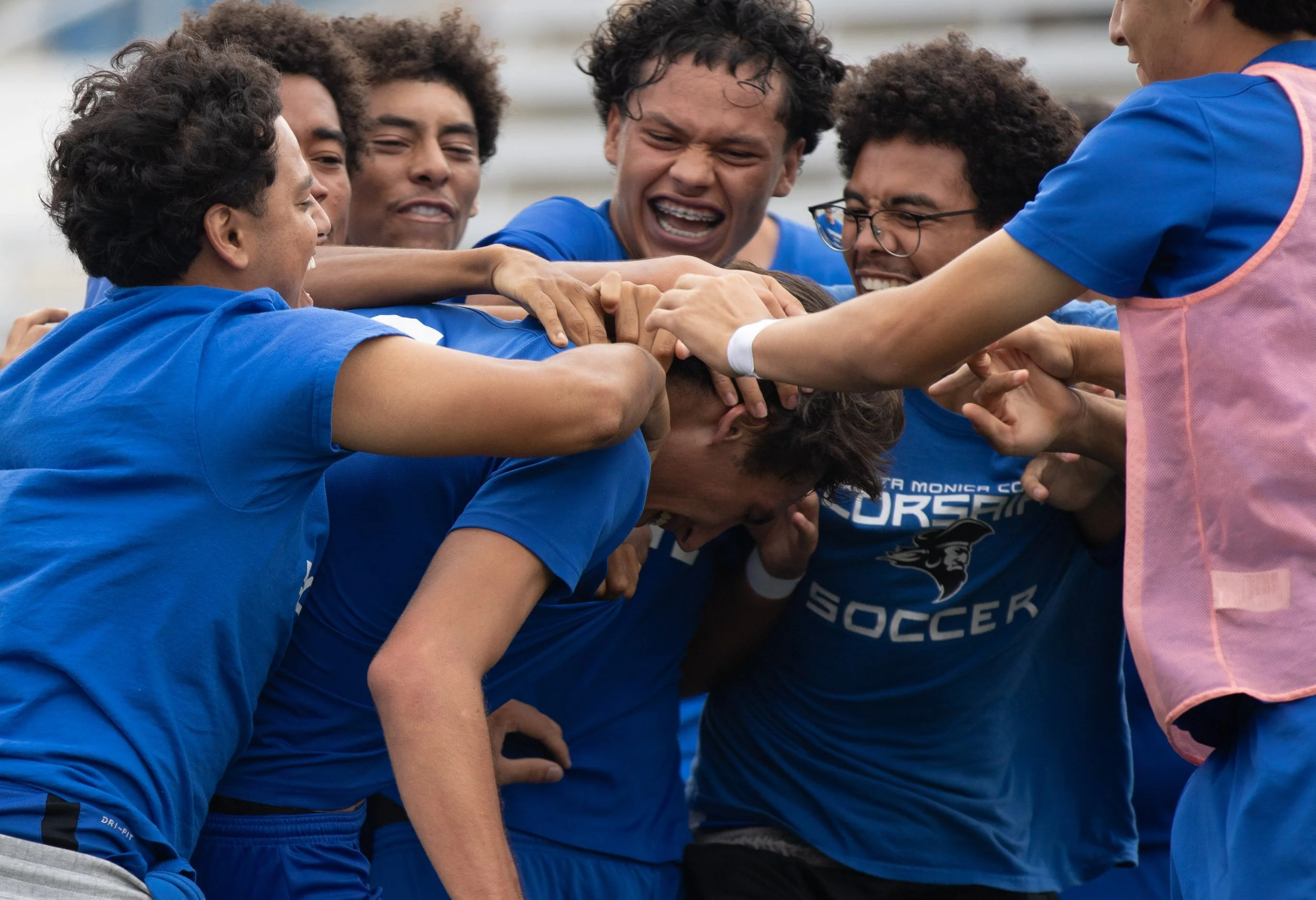  The Corsairs team surround No. 8 Leo Blanchet after he scored a goal against the Mustangs, tying both teams to a 3-3. (Melissa Ochoa Garcia|The Corsair) 