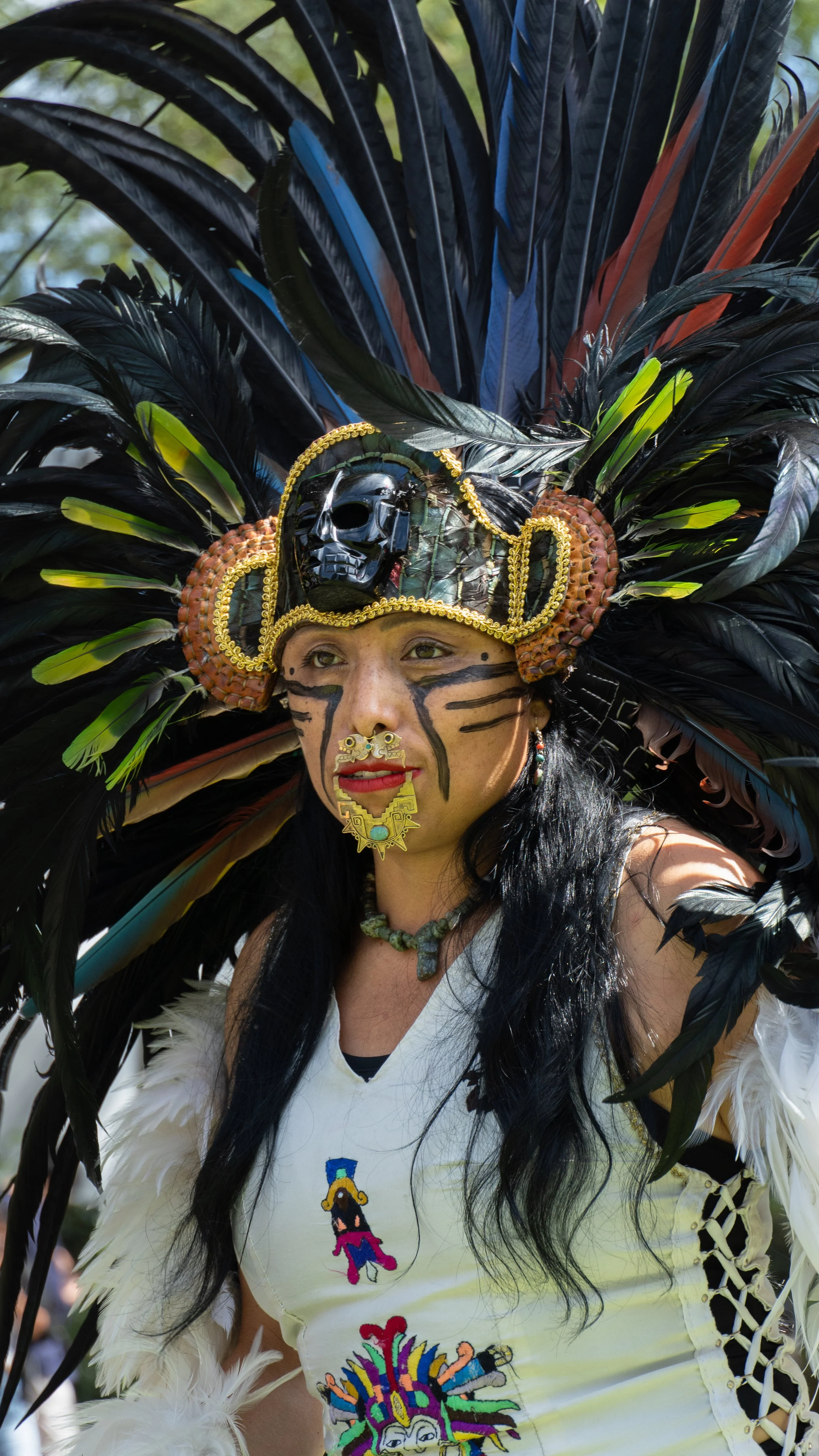  Aztec Dancer Araceli Contreras wears a black skull decorated head piece and traditonal gold facial jewelry during a Latinx Heritage Month performance at Santa Monica College in Santa Monica, Calif., on Thursday, Sept. 17th, 2026. The celebration on 