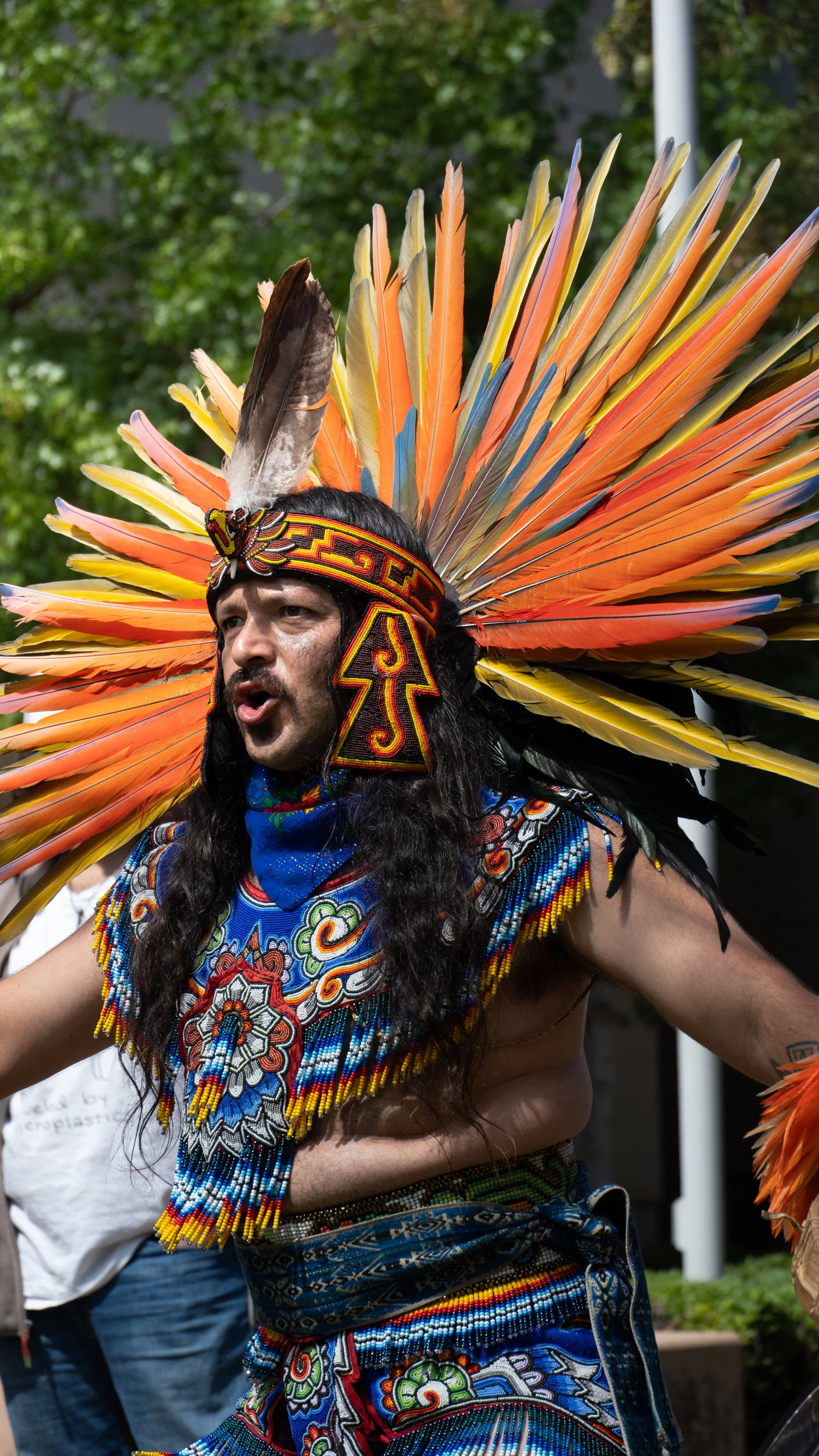  Aztec dancer and leader of the performance, Xochipilli Medrano chants during a traditional performance in full feather cultural clothing during a Latinx Heritage Month event at Santa Monica College in Santa Monica, Calif., on Thursday, Sept. 17th, 2
