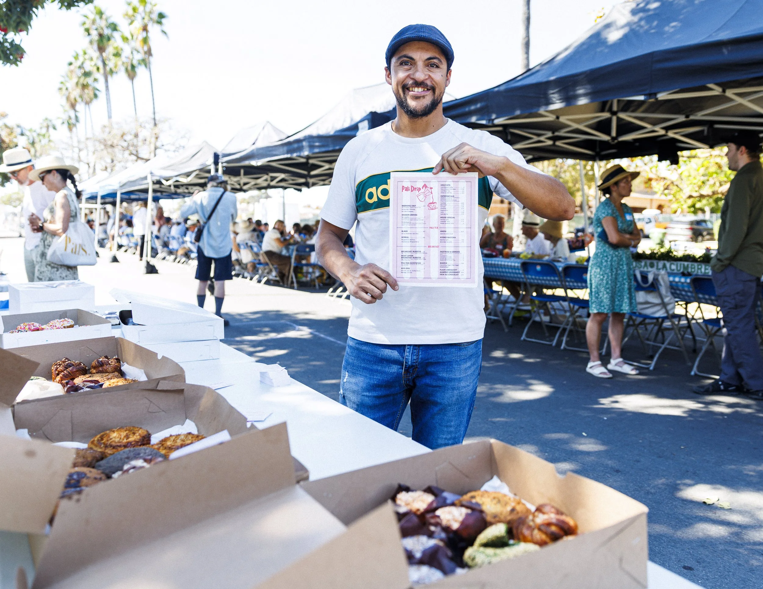  Eddie Navarro, who runs the recently opened Pali Drip, poses for a photograph during the second annual Longest Table Potluck Picnic Sunday, Oct. 4, 2026, on Pampas Ricas Blvd. in Pacific Palisades, Calif. Navarro originally opened Estate Coffee in 2
