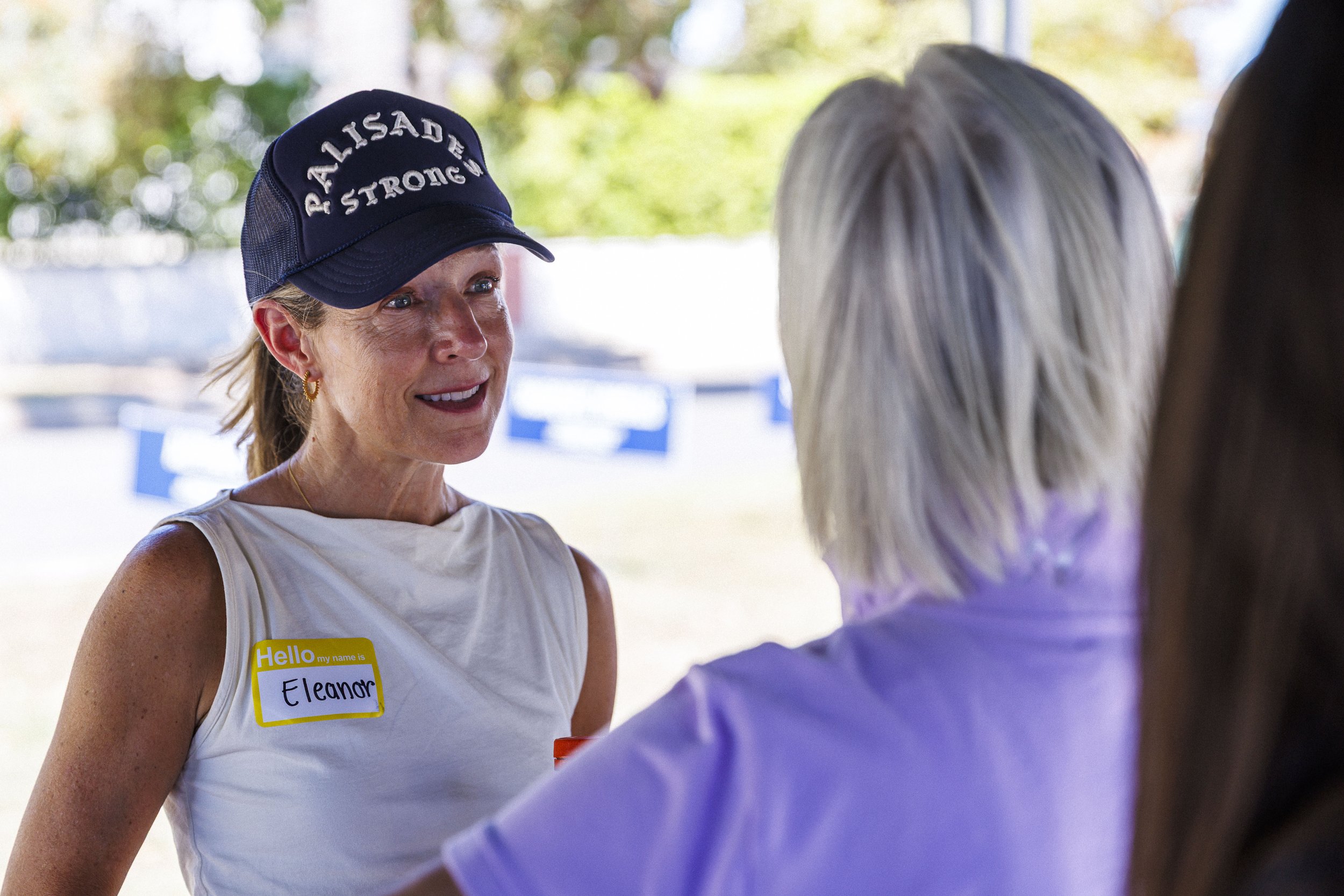  Pacific Palisades community member Eleanor Keare interacts with other residents during the second annual Longest Table Potluck Picnic Sunday, Oct. 4, 2026, on Pampas Ricas Blvd. in Pacific Palisades, Calif. Keare, who currently lives in the Bay Area