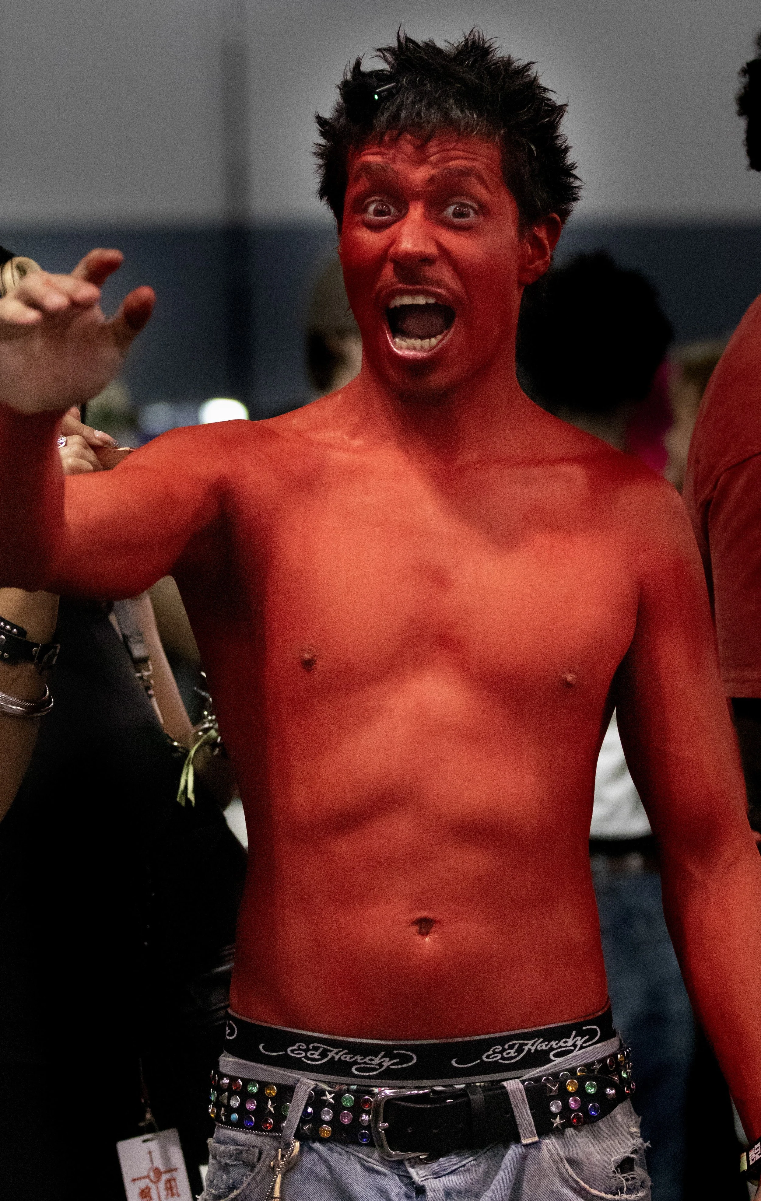  Tavo Diaz or also known as “The Red Guy” on instagram (_tavo777), is a Mexican Creative Director who is owner of his very own clothing brand tdomstudios. At the Los Angeles Convention Center at Complex Con on Saturday October 3rd, 2026, he painted h