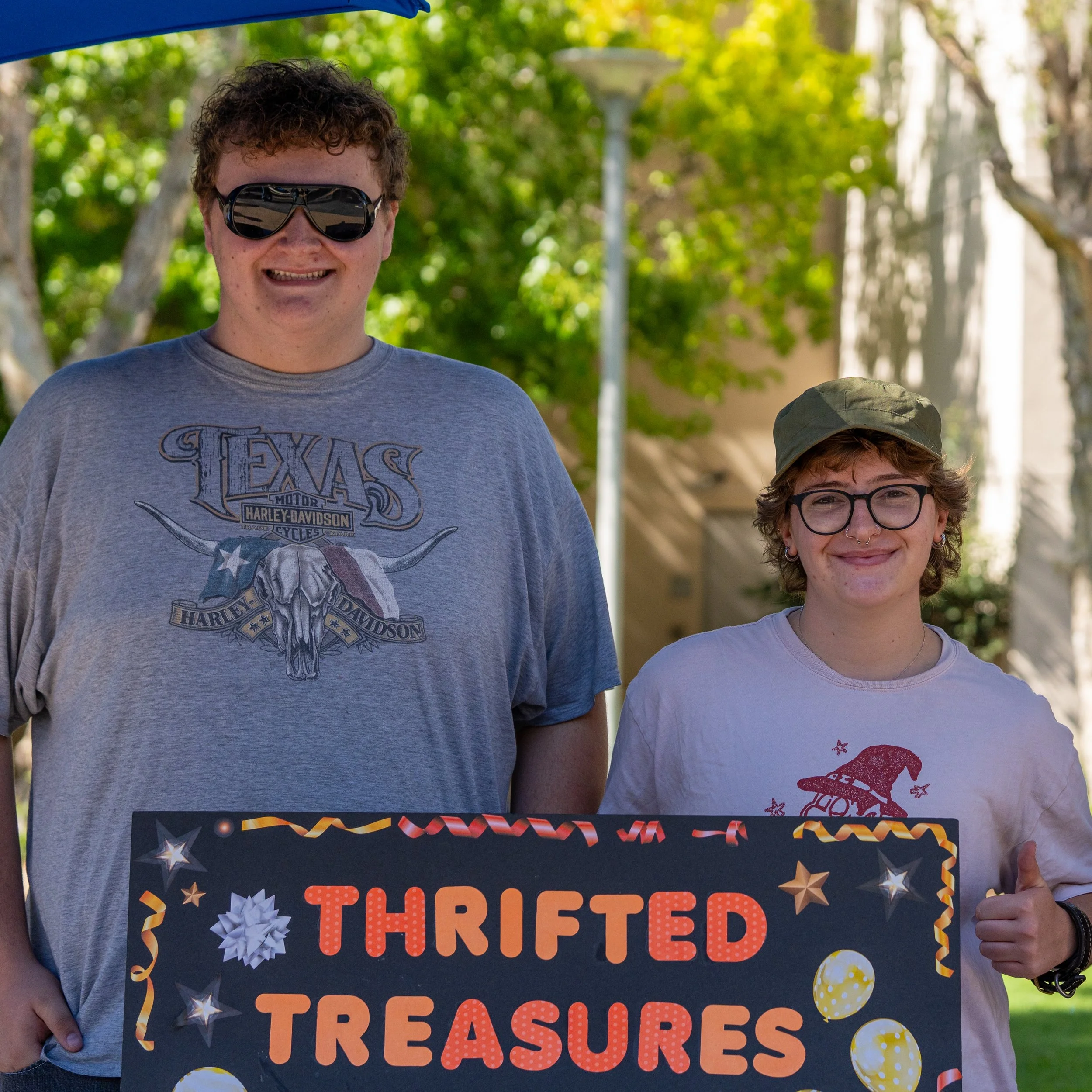  Thrifted Treasures Club president Justin Goldstein on the left, and vice president Grayson David holding the club's sign during Club Awareness on the Main Quad at Santa Monica College in Santa Monica, Calif., on Tuesday, Sept. 29, 2026. The club enc