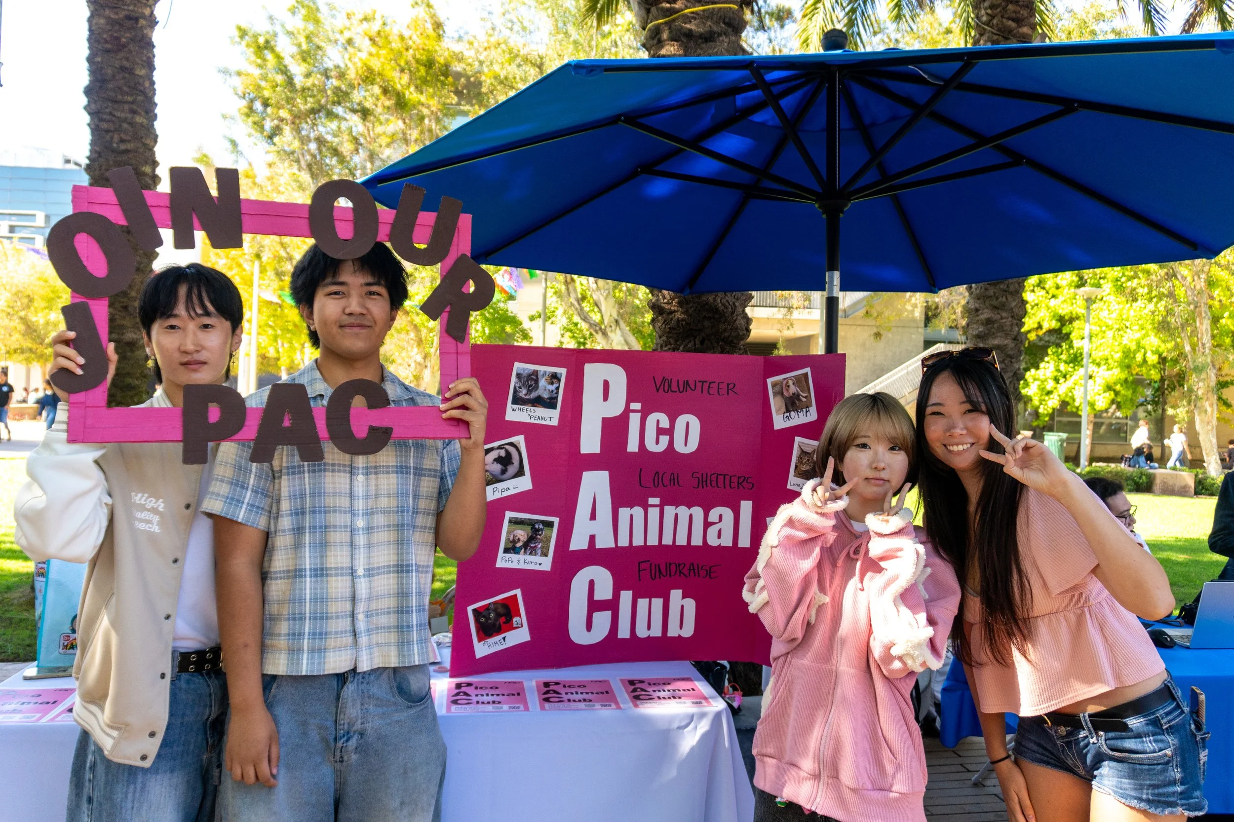  Pico Animal Club members, from left, secretary Joseph Huang, Inter-Club Council representative Colin Romana, publisher Sakura Koreeda and president Yuuka Yamagishi pose at the club's table during Club Awareness on the Main Quad at Santa Monica Colle