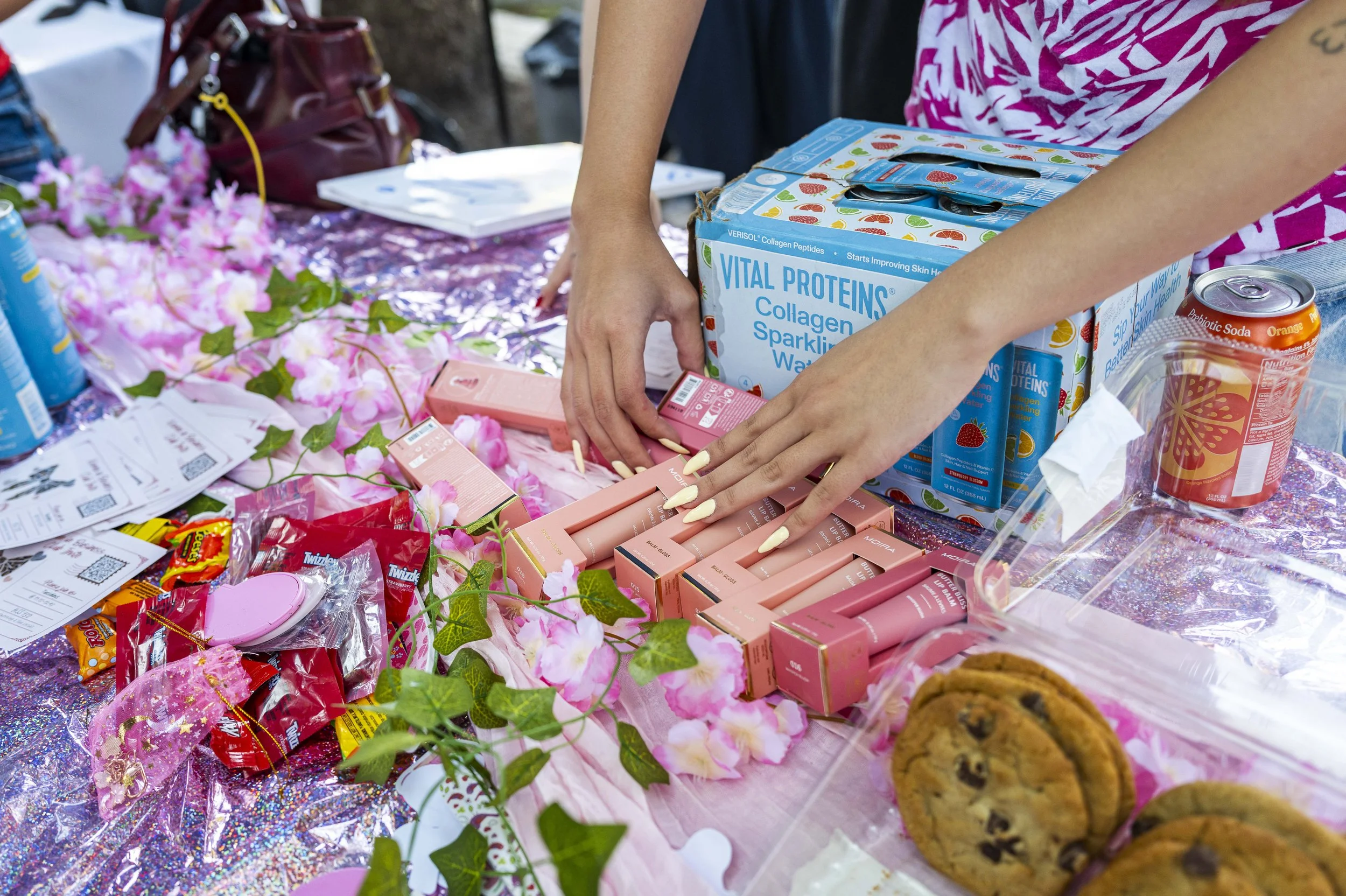  Santa Monica College (SMC) Women in Business Club President Vee Lee arranges a display of free samples at their booth during Club Awareness Day on the SMC Main Campus Quad on Tuesday, Sept. 29th, 2026, in Santa Monica, Calif. The purpose of their cl