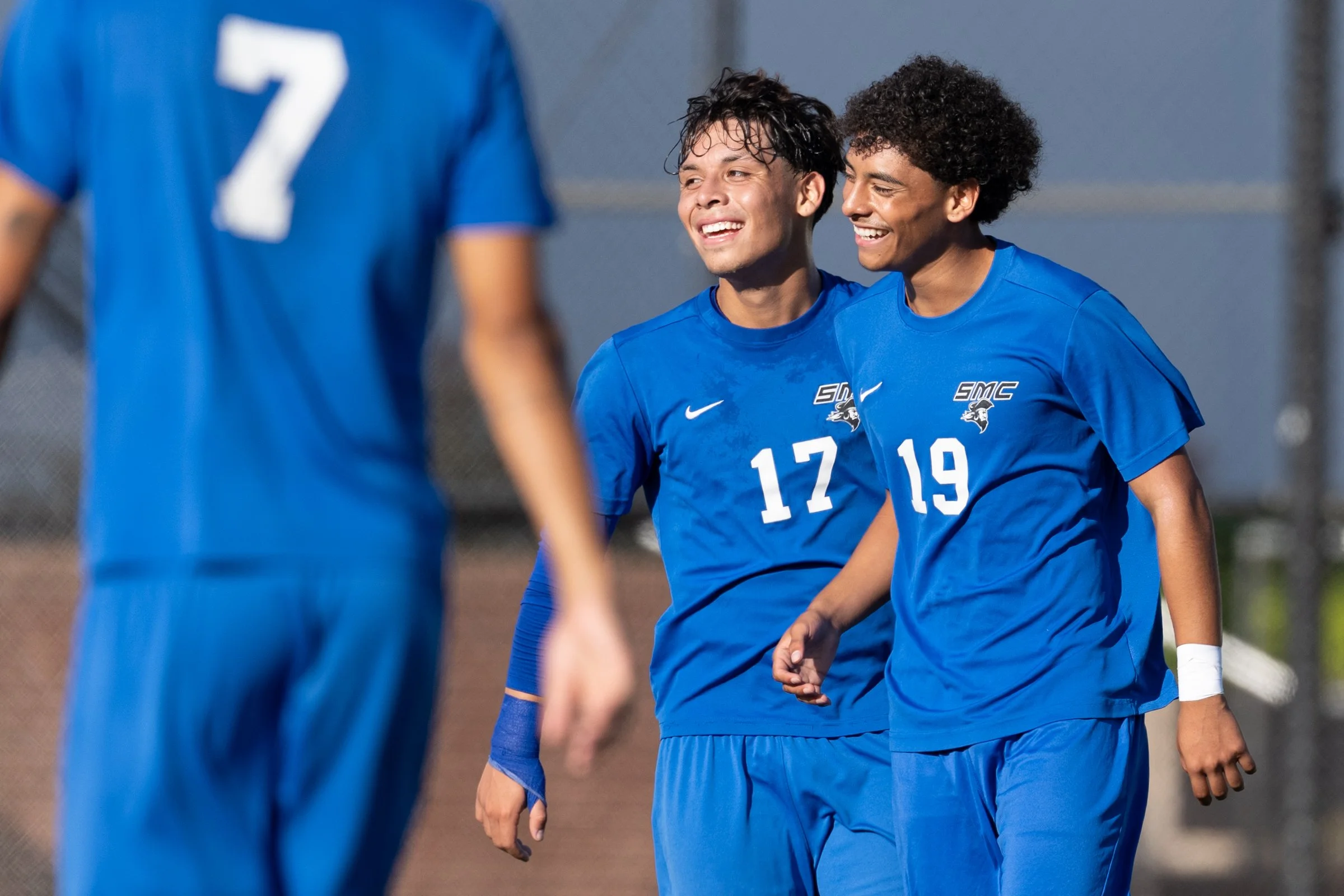 The Santa Monica College Corsairs Melvin Santa Cruz (19) celebrates with teammate Zen Franco (17) after a scored goal, by Santa Cruz (19), in the first half of the matchup against College of the Canyons Cougars on Tuesday, Oct. 13, 2026, at Corsair 