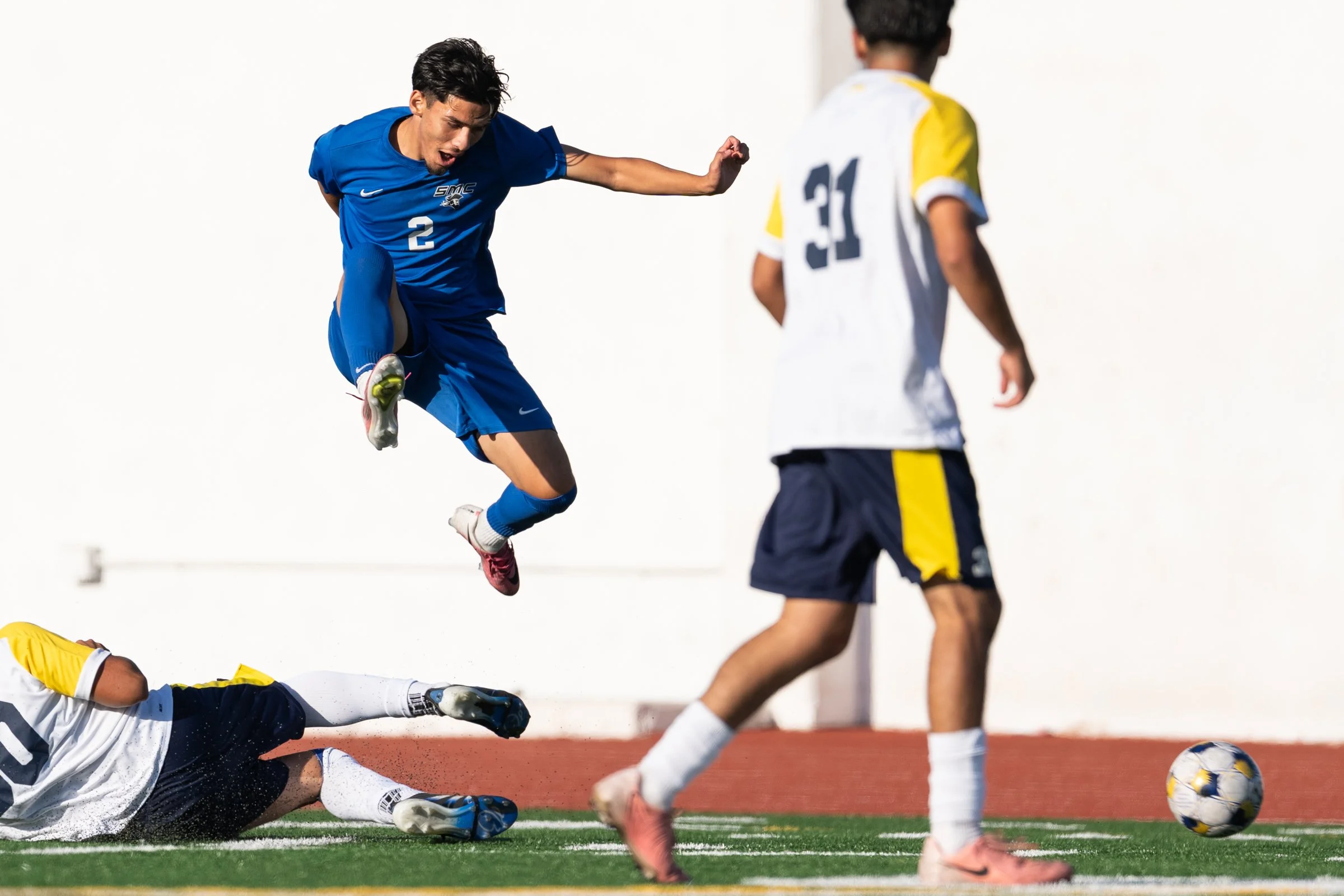  The Santa Monica College Corsairs Juan Hermosillo (2) leaps over the defender that kicks the ball out of play in first half of the game against College of the Canyons Cougars on Tuesday, Oct. 13, 2026, at Corsair Field in Santa Monica, Calif. Hermos