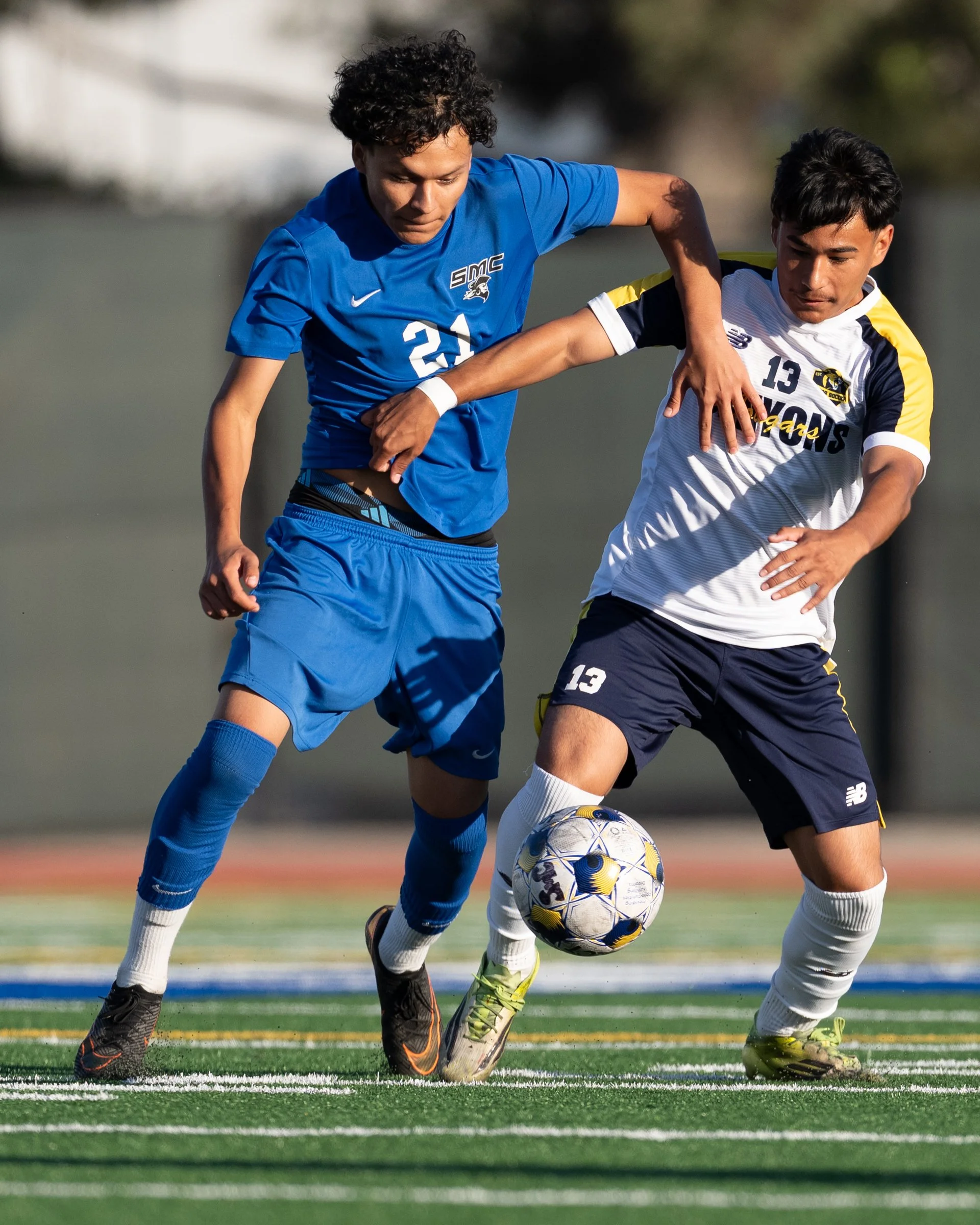  The Santa Monica College Corsairs Angel Diaz (21) battles College of the Canyons Cougars Diego Chavez (13) for the ball during the second half of the game on Tuesday, Oct. 13, 2026, at Corsair Field in Santa Monica, Calif. Corsairs Diaz had three as