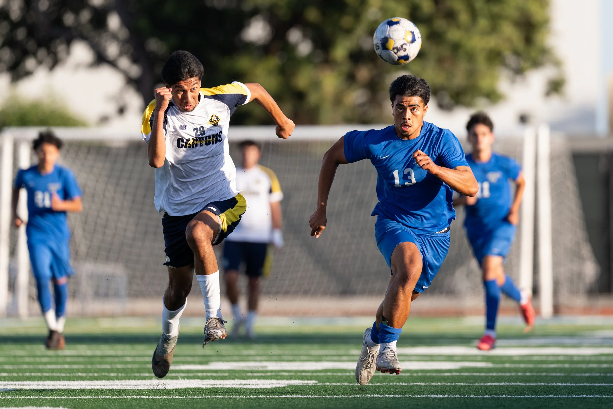  The Santa Monica College Corsairs Noah Johannes (13) and College of the Canyons Cougars Isaac Negrete (28) race for the ball during the second half of the matchup   on Tuesday, Oct. 13, 2026, at Corsair Field in Santa Monica, Calif. Corsairs defeate