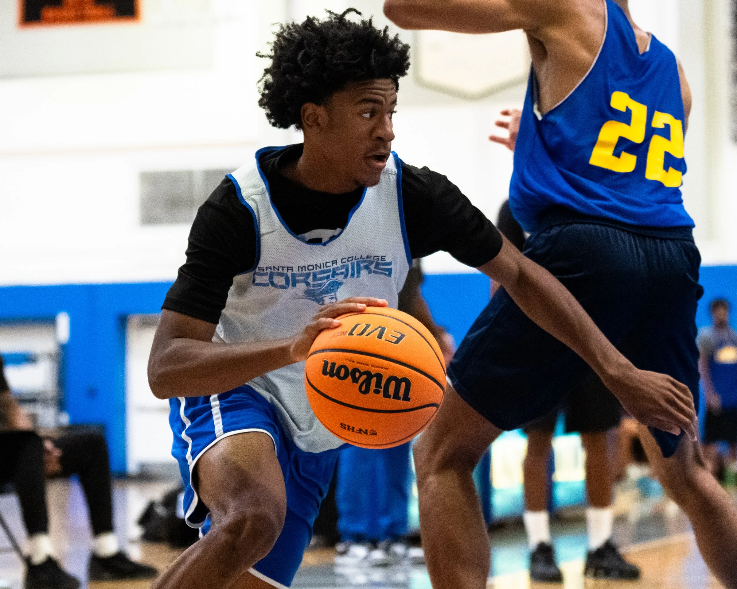  The Santa Monica College (SMC) Corsairs Men’s basketball Jaylen Brown (12) dribbles by LA Harbor College Seahawks defender (22) and looks to attack the goal in the second half of the scrimmage game on Friday, Oct. 16, 2026, at Corsair Gym in Santa M