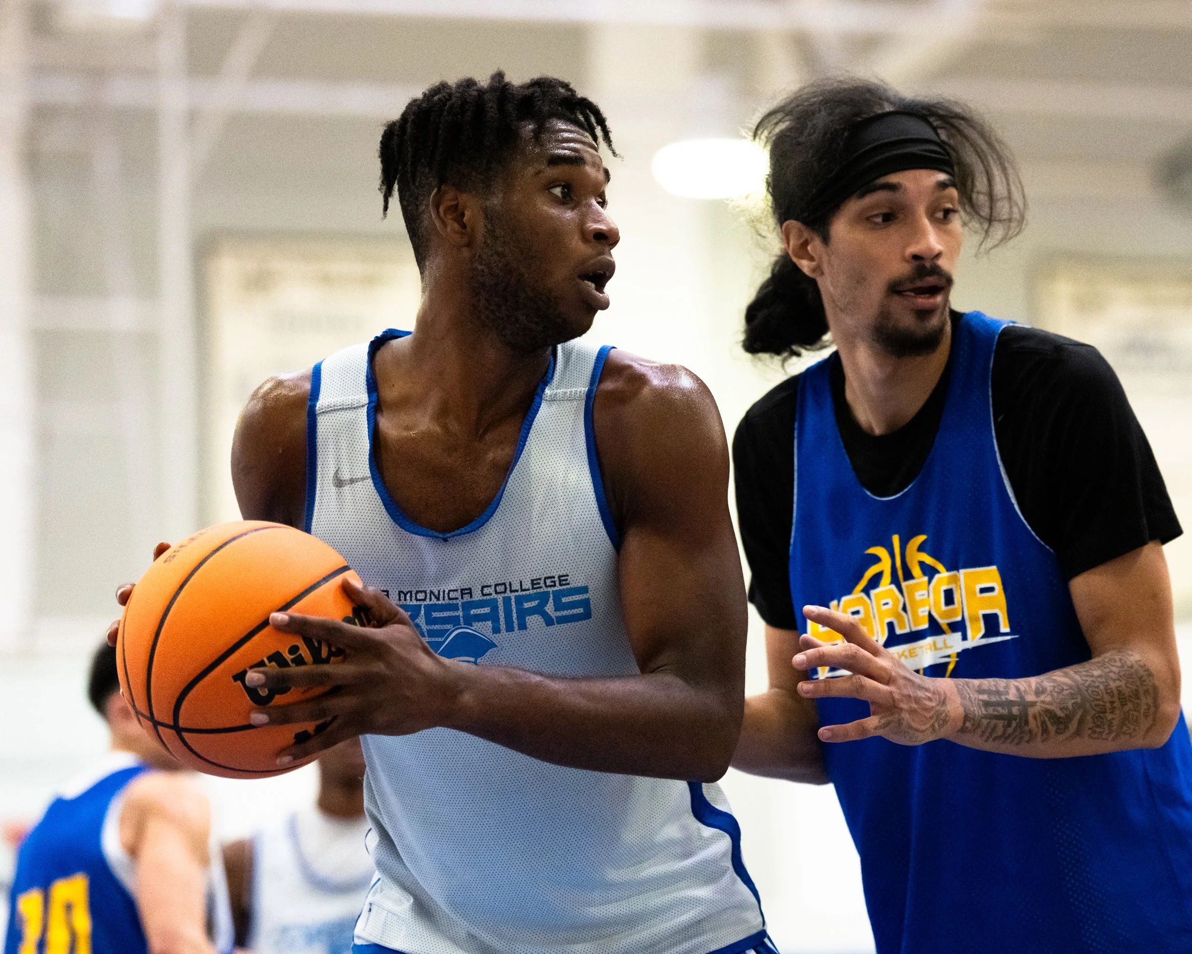  The Santa Monica College (SMC) Corsairs Men’s basketball Micah Blackman (3) with the ball in the low post  being guarded by LA Harbor College Seahawks defender in the second half of the scrimmage game on Friday, Oct. 16, 2026, at Corsair Gym in Sant