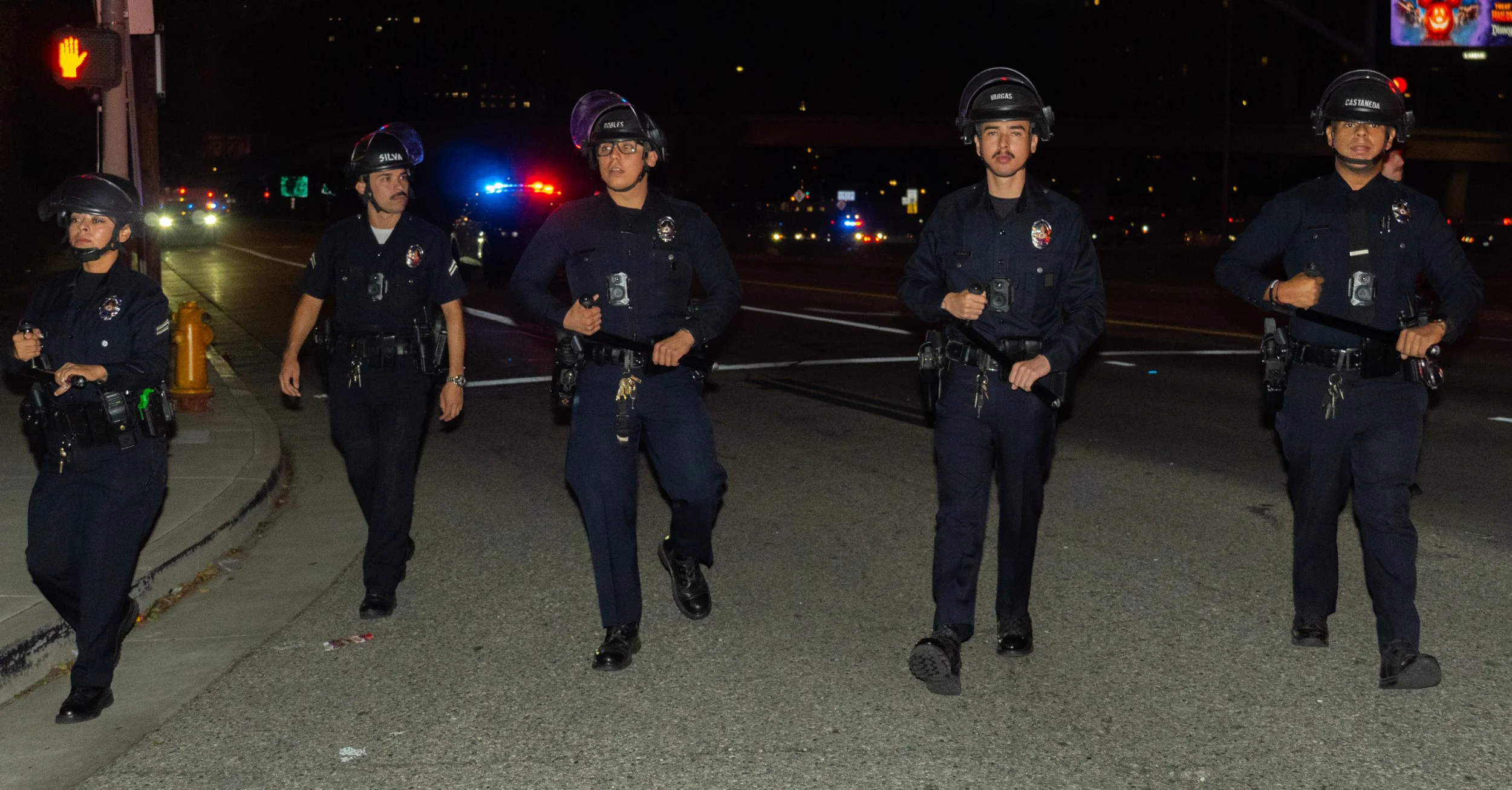  Los Angeles Police Department officers continue to march against journalists and protestors near the Metropolitan Detention Center on Saturday October 17th, 2026. (Andy Garcia | The Corsair) 