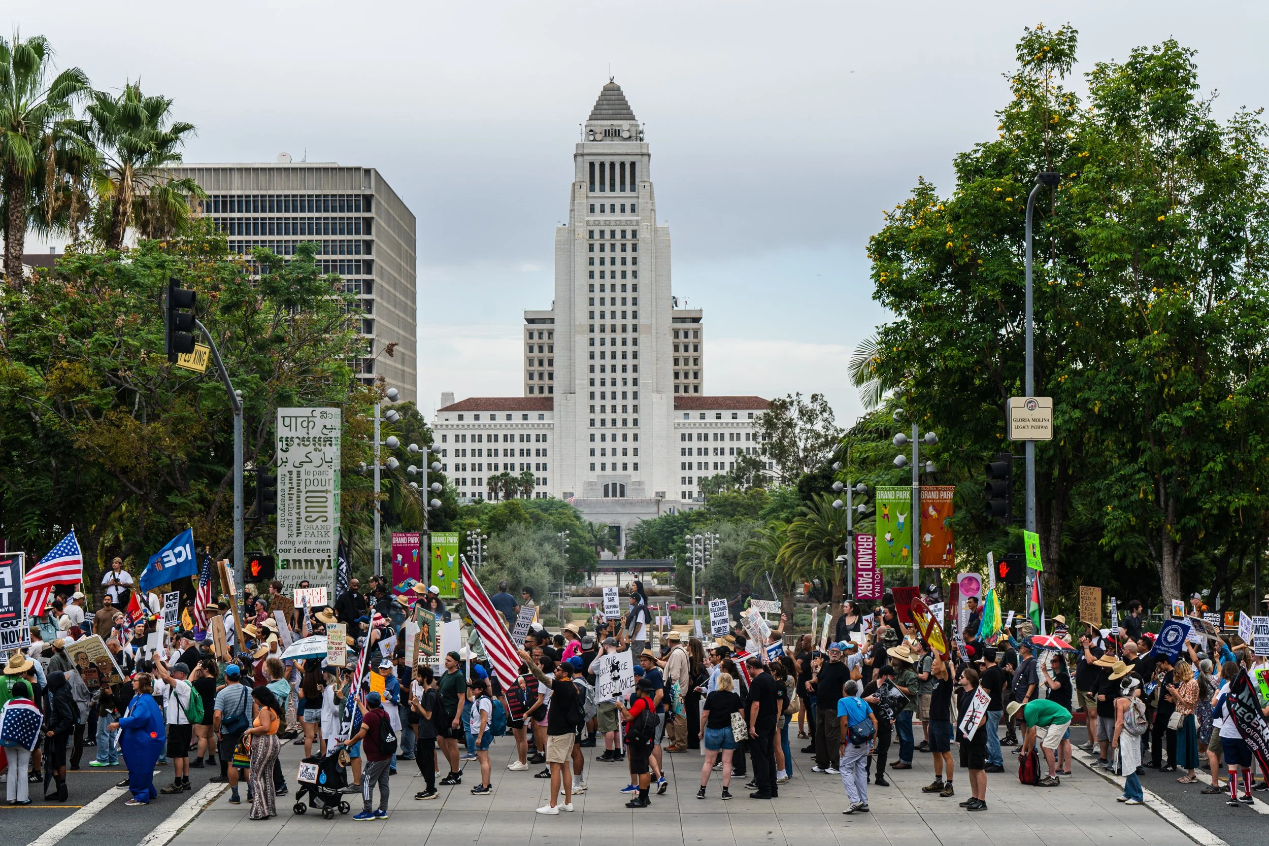  Protestors marching north on Grand Ave. with Los Angeles City Hall in the background on Saturday, Oct. 17, 2026. (Steve Lopez | The Corsair) 