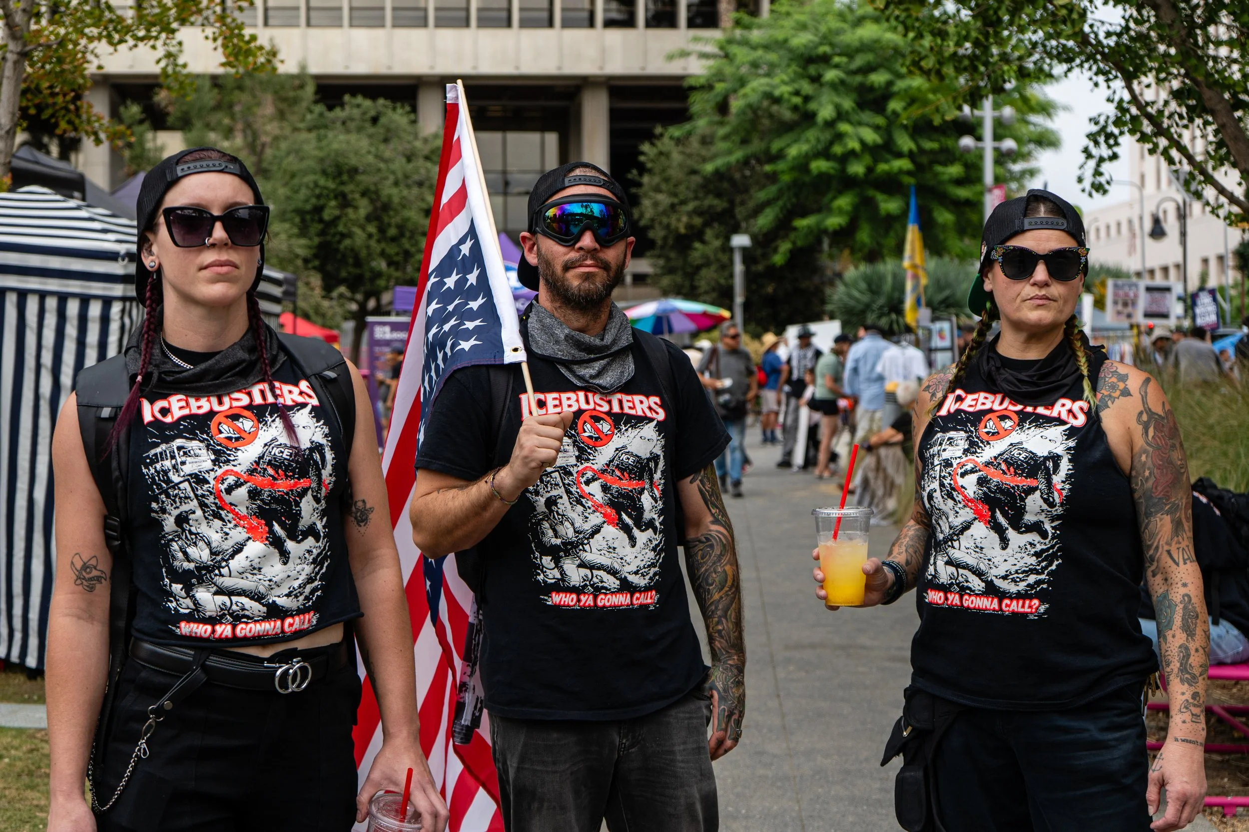  Ice Busters activists wearing 'Icebusters' T-shirts walking at Grand Park in front of Los Angeles City Hall on Saturday, Oct. 17, 2026. (Steve Lopez | The Corsair) 