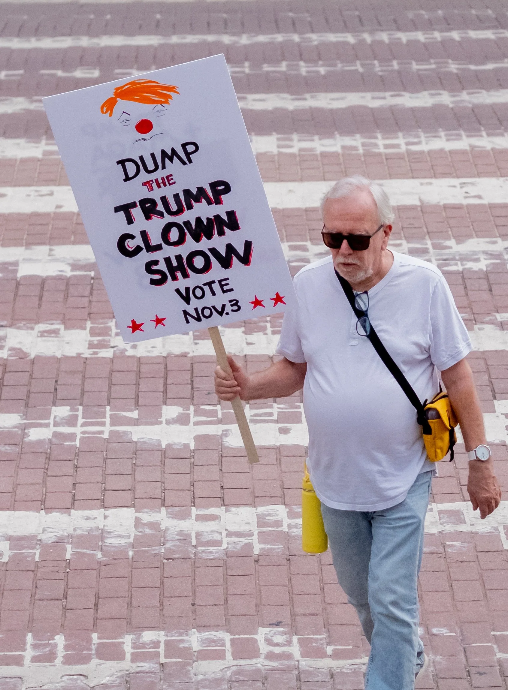  A Protester Holding a sign "Dump The TRUMP CLOWN SHOW Vote Nov.3 "protest at City Hall in downtown Los Angeles, Saturday, Calif. Oct. 17. (Jose Hernandez | The Corsair) 