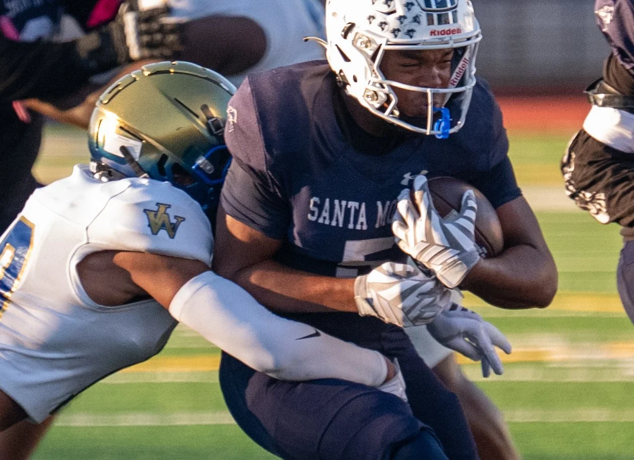  Santa Monica College (SMC) Corsair running back Dylan Franklin (5) breaks a tackle during the Homecoming game against the West Los Angeles Wildcats at Corsair Field in Santa Monica, Calif., on Saturday, Oct. 24, 2026. The Corsairs defeated the Wildc