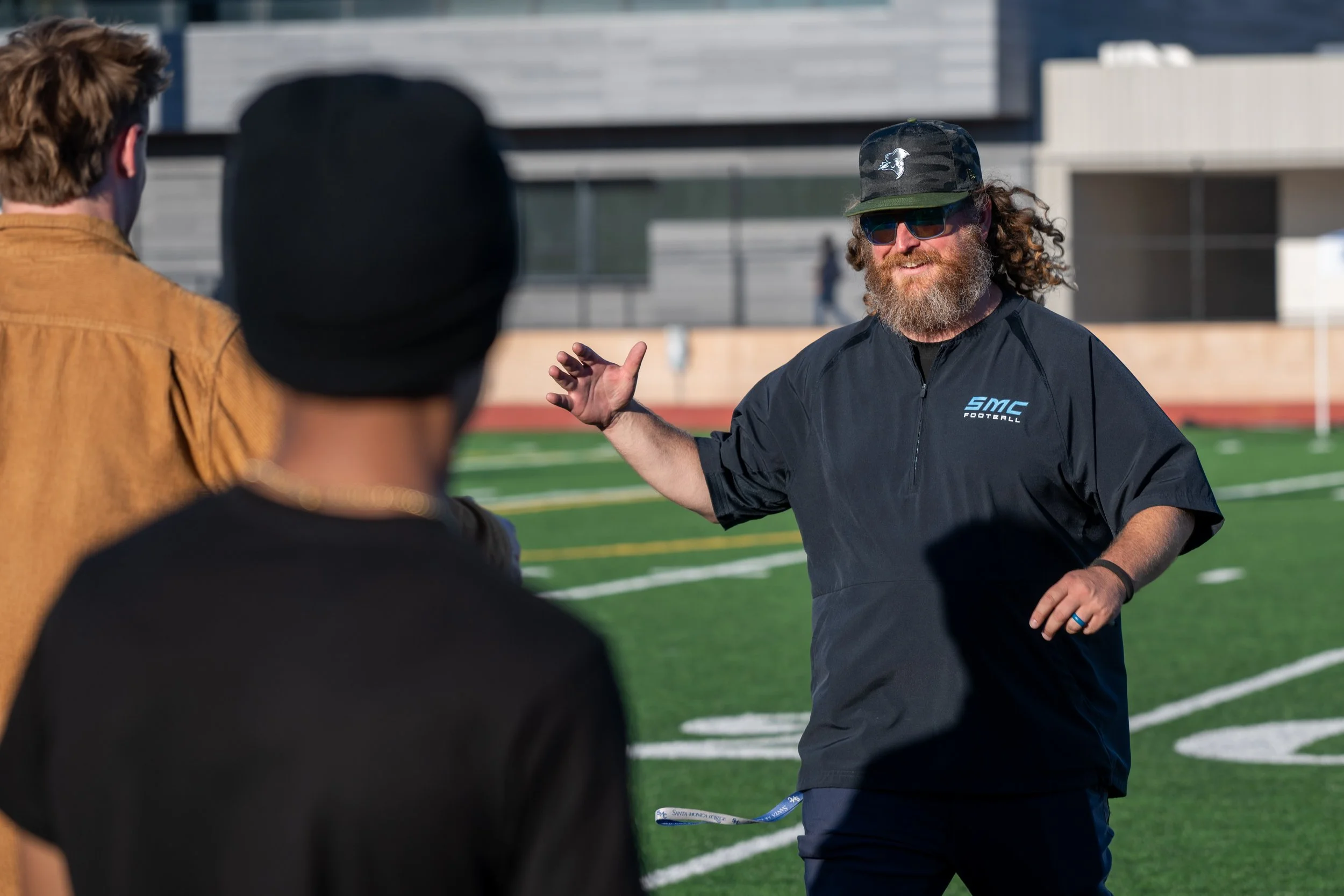  Santa Monica College (SMC) Corsair Coach Kelly Ledwith greating a freind prior to the Homecoming game with the West Los Angeles Wildcats at the Corsair Field in Santa Monica, Calif., on Saturday, Oct. 24, 2026. The Corsairs defeated the Wildcats 51-