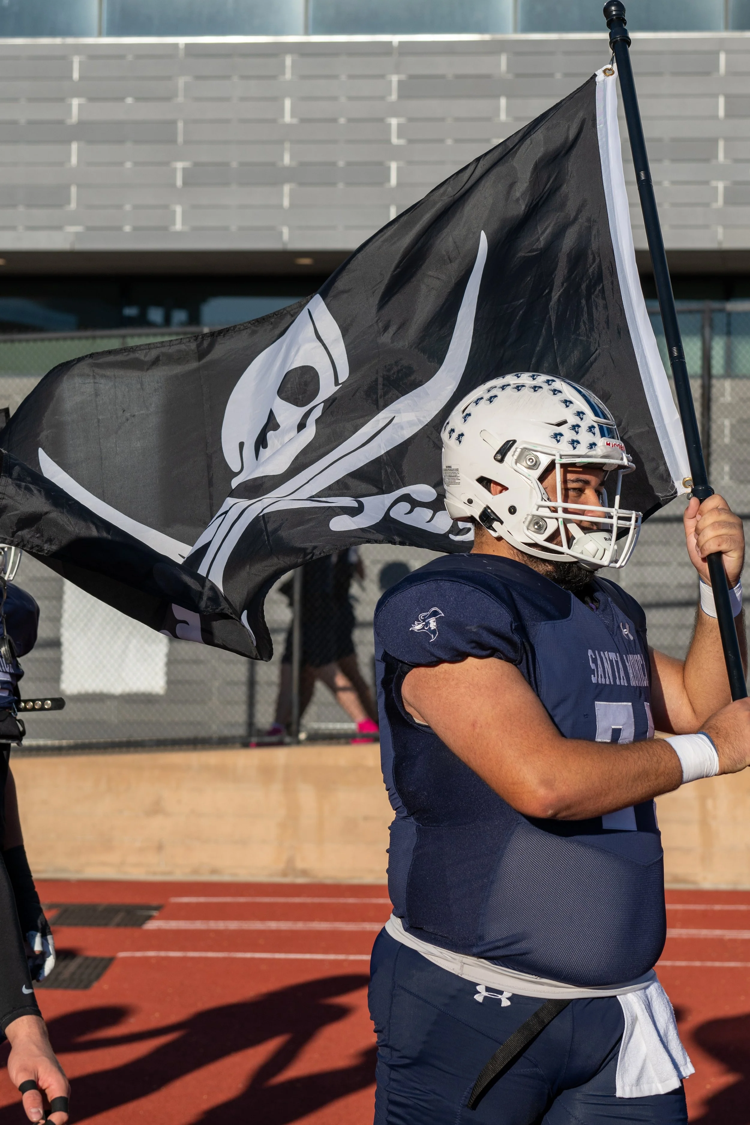  Santa Monica College (SMC) Corsair offensive lineman Xavier Terry (74) led the team out on the field to carry the school flag prior to the Homecoming game with the West Los Angeles Wildcats at the Corsair Field in Santa Monica, Calif., on Saturday, 