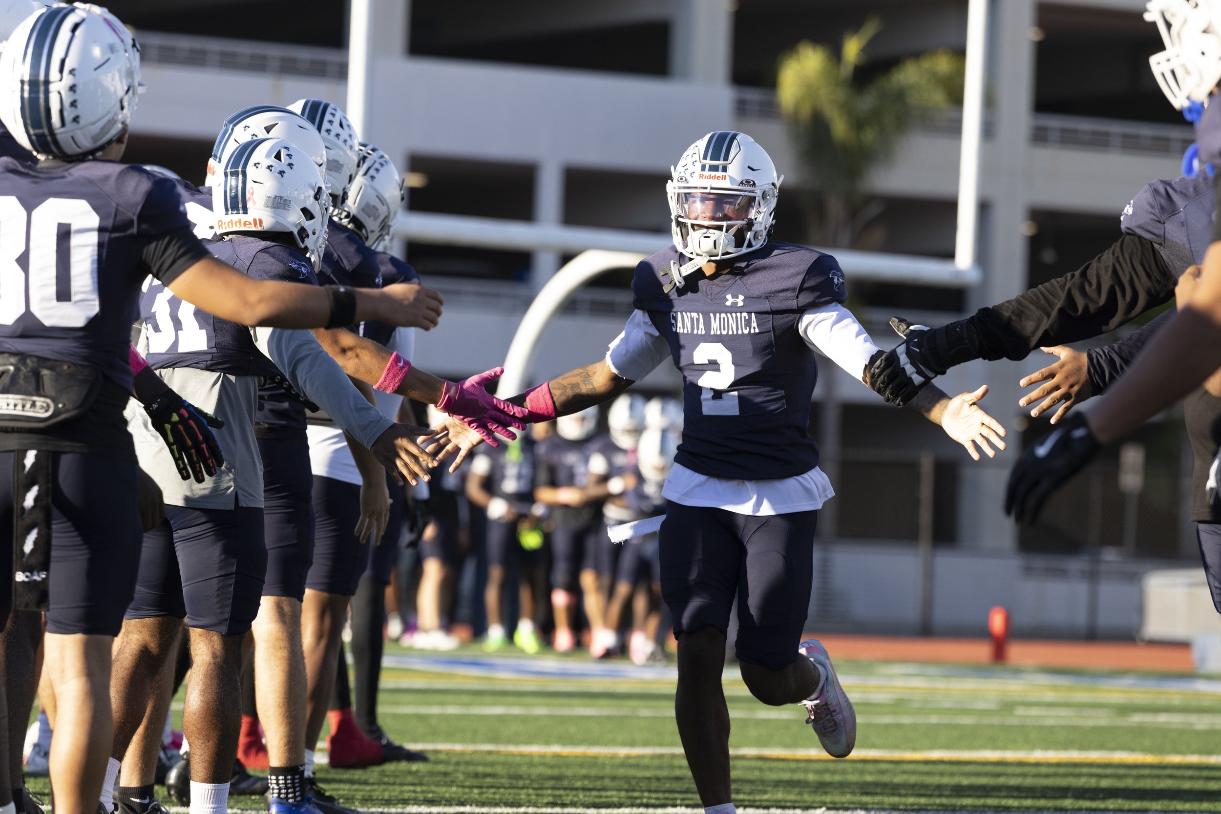  Santa Monica College (SMC) wide receiver and Sophomore Lamont White (2) runs onto the field, celebrated by his fellow Corsairs for the Homecoming game against the West Los Angeles College Wildcats on Saturday, Oct. 24, 2026, at Corsair Field in Sant