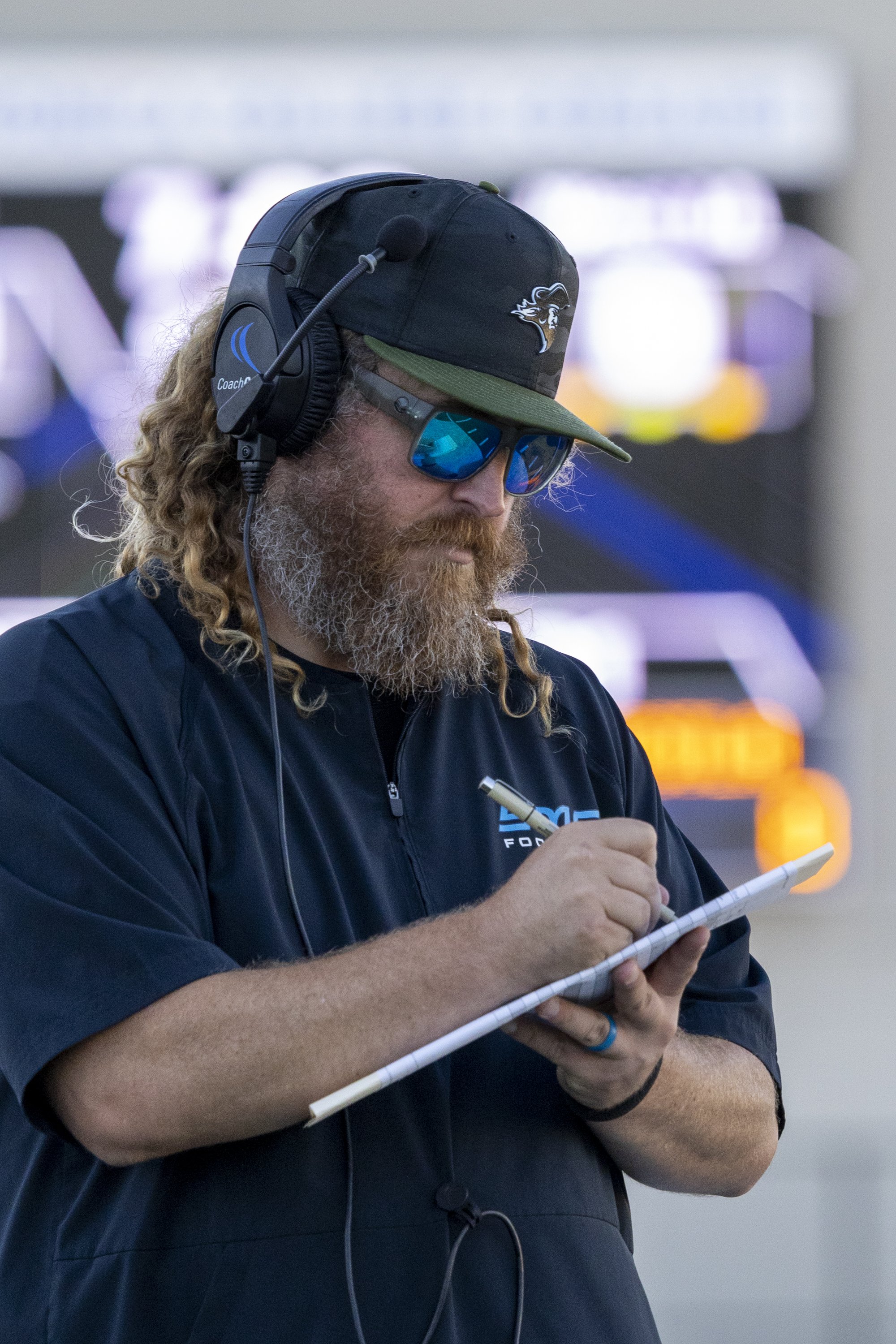  Head coach Kelly Ledwith (R) of the Santa Monica College (SMC) Men’s Football Corsairs takes notes during the SMC Homecoming game against the West Los Angeles College Wildcats on Saturday, Oct. 24, 2026, at Corsair Field in Santa Monica, Calif. The 