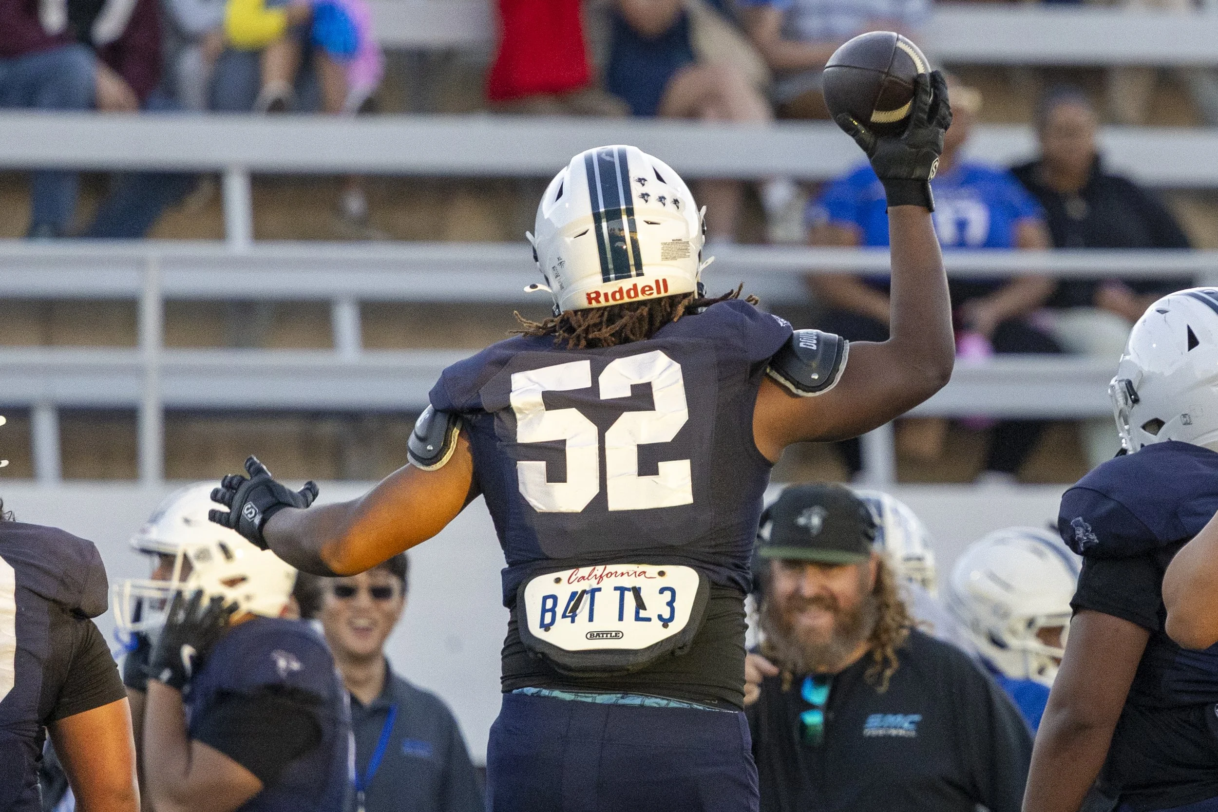  Santa Monica College (SMC) Men’s Football Corsair and defensive lineman Jody Lamb (52) celebrates with football coach Kelly Ledwith after intercepting a pass during the Corsairs’ Homecoming game against the West Los Angeles College Wildcats on Satur