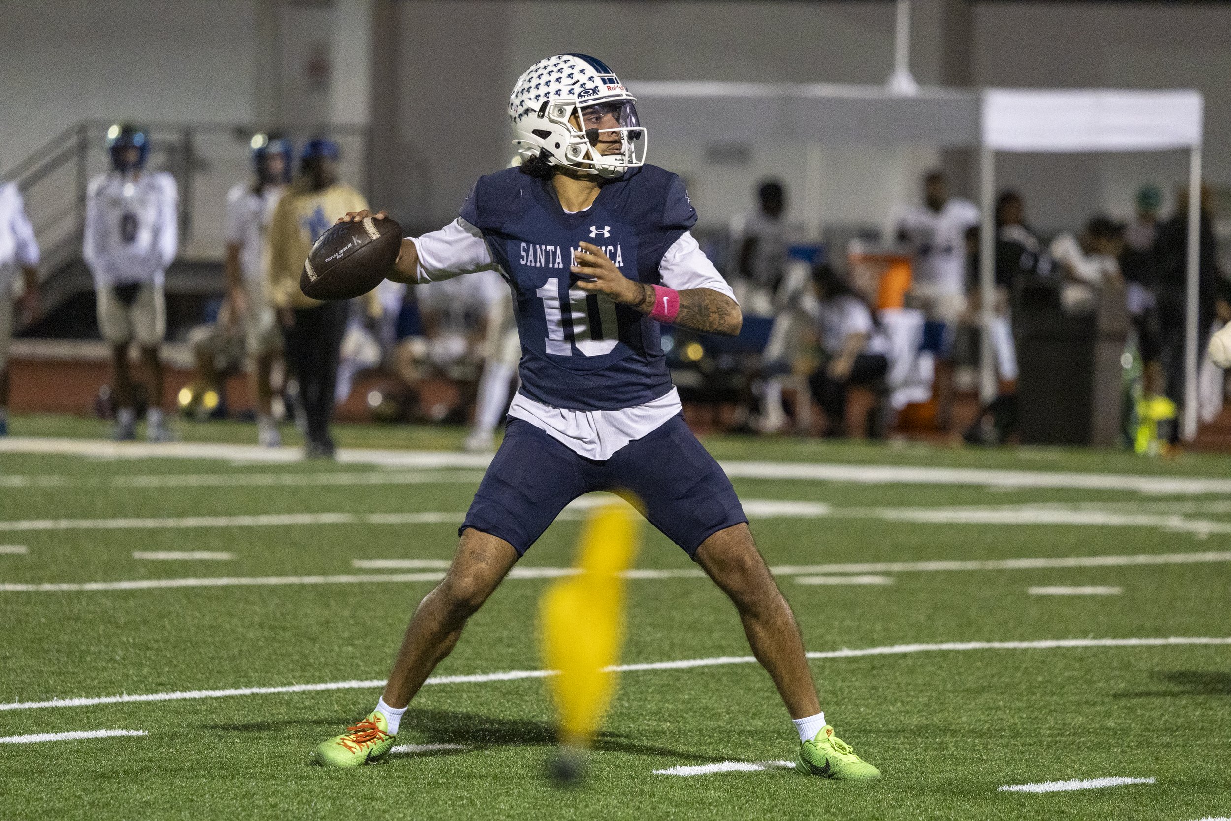  Quarterback Pierce Clarkson (10), Santa Monica College (SMC) Men’s Football Corsair, looks for a pass while a flag is thrown on the field during the SMC Homecoming game against the West Los Angeles College Wildcats on Saturday, Oct. 24, 2026, at Cor
