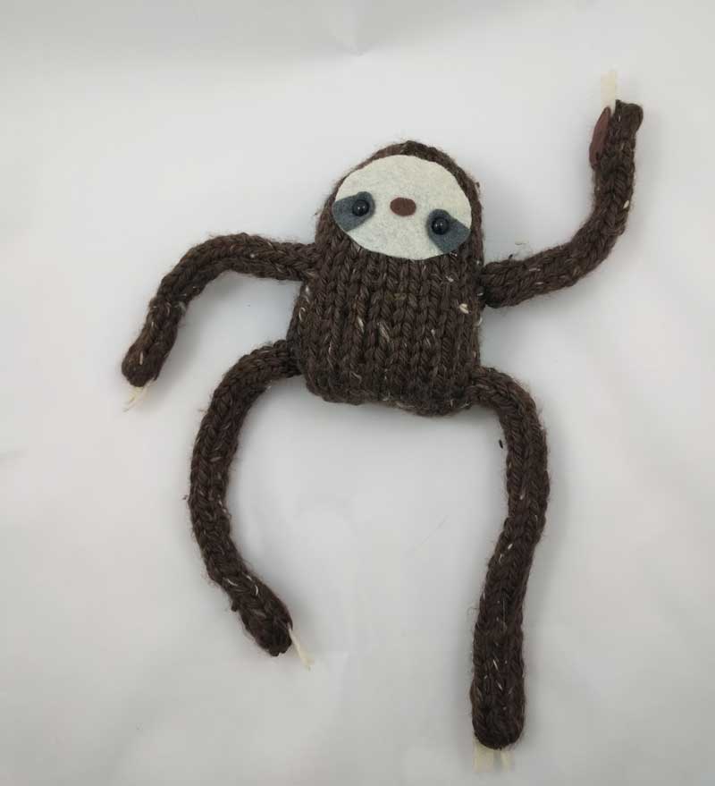 jombo_sloth_laying_flat.jpg