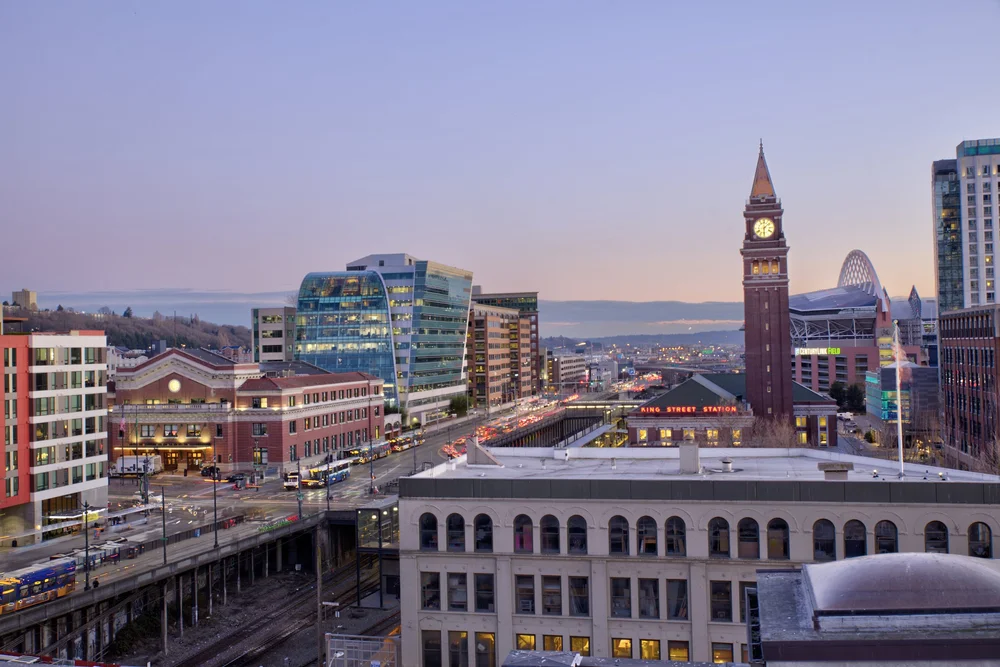 View from a listing's deck over downtown Seattle at dusk