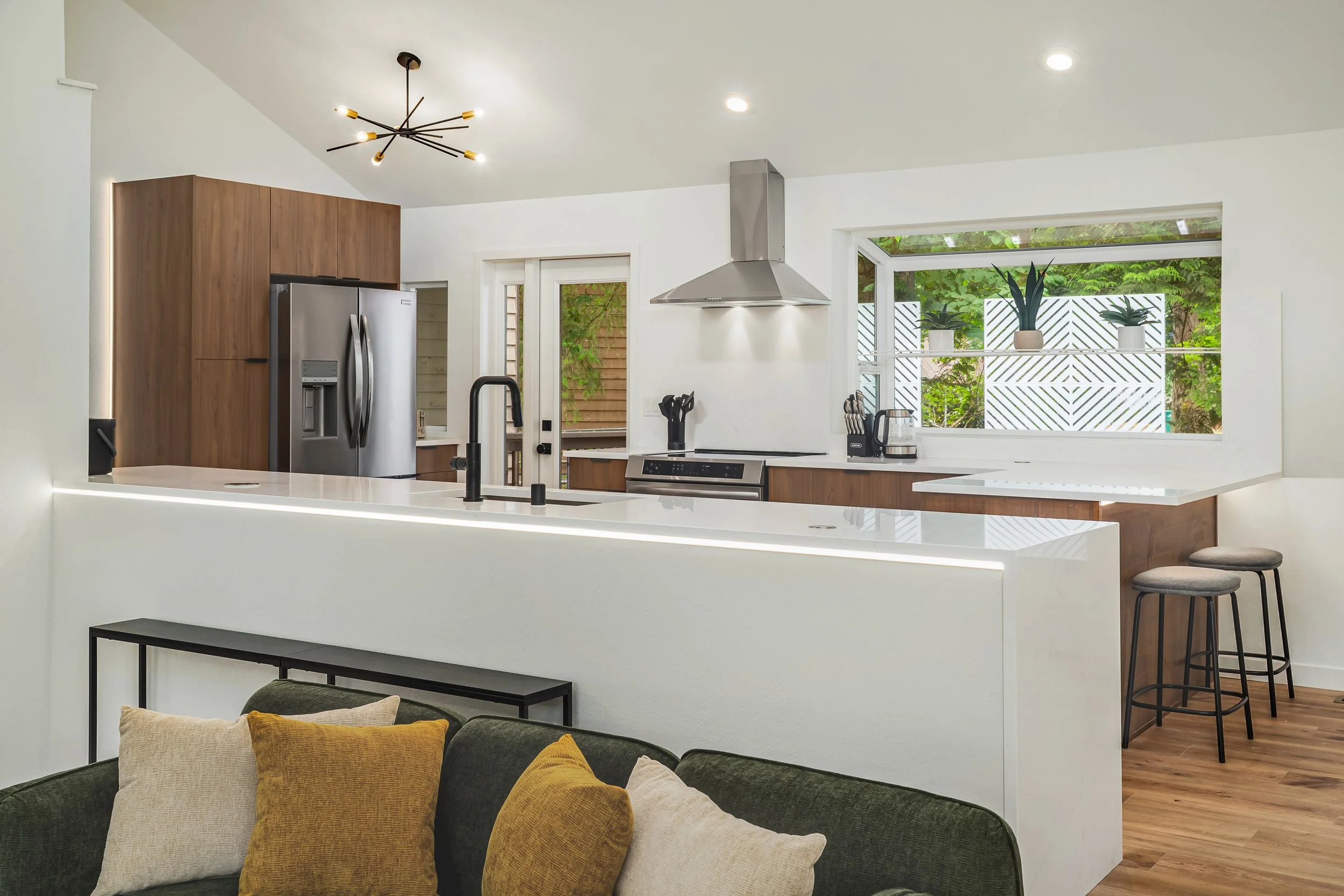 Kitchen opens onto living room