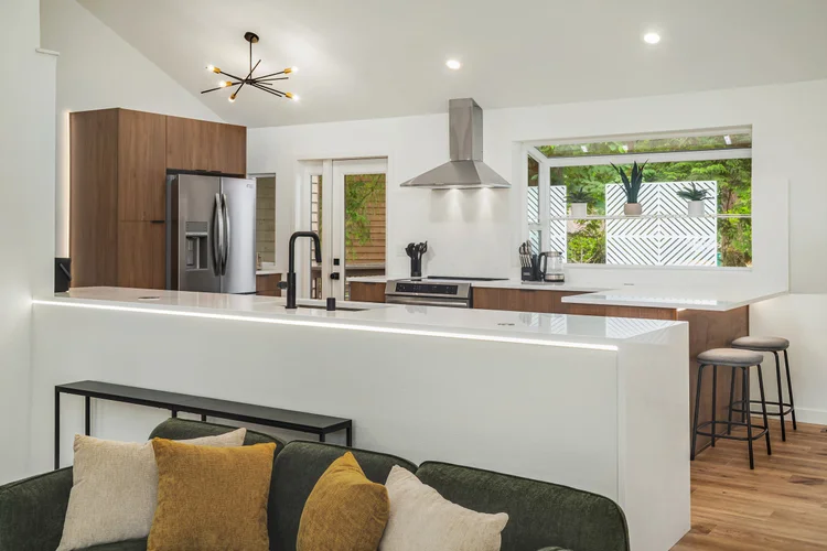 Kitchen opens onto living room