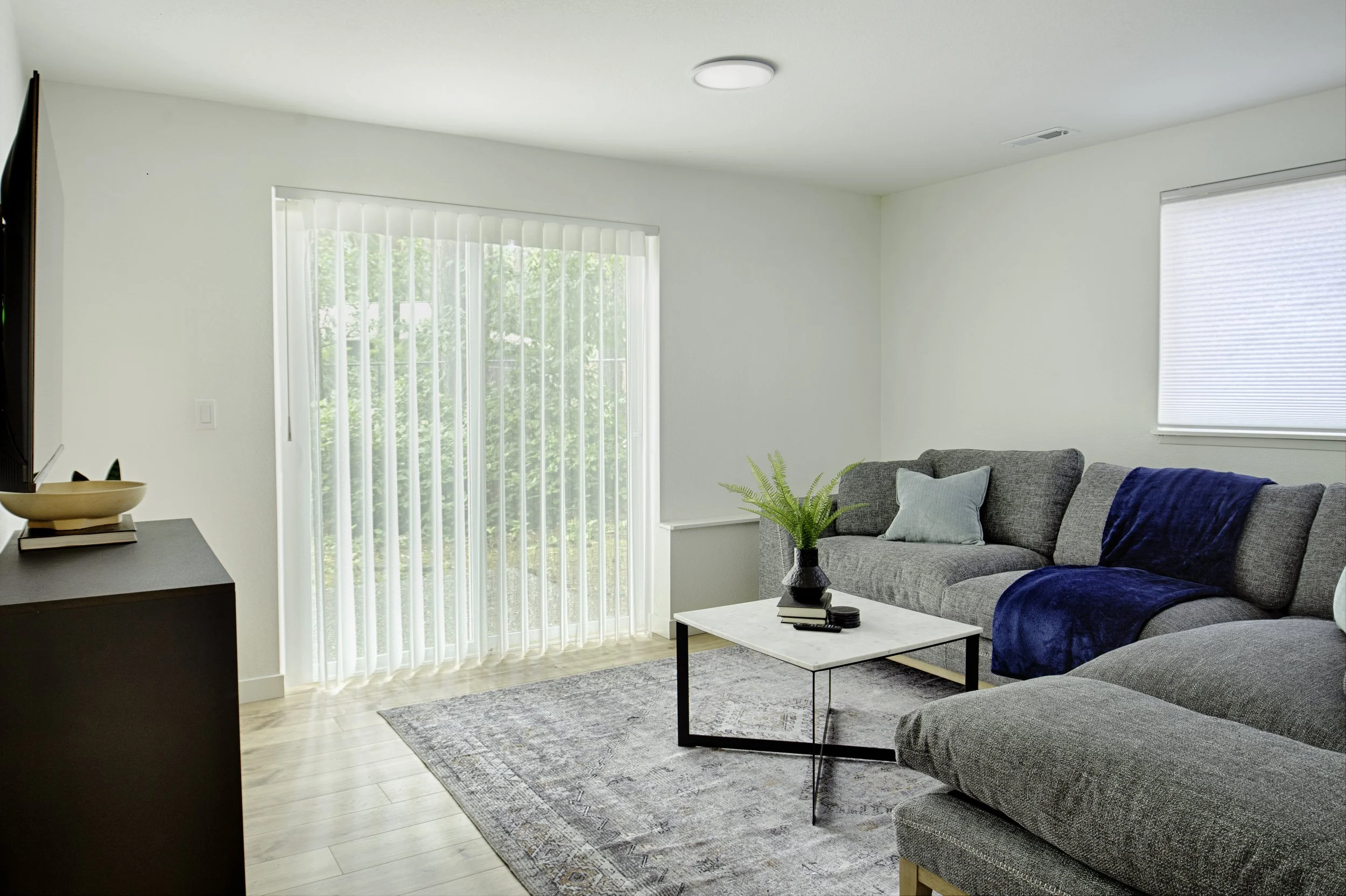 Family room with door to fenced yard