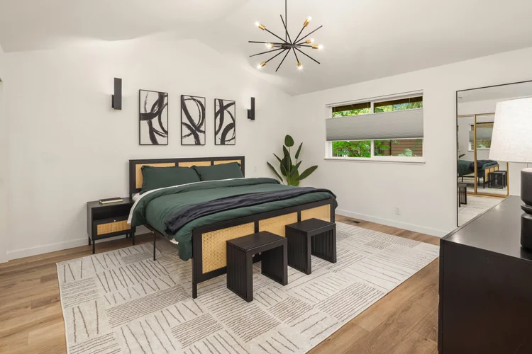 Huge primary suite with king-size bed and vaulted ceilings