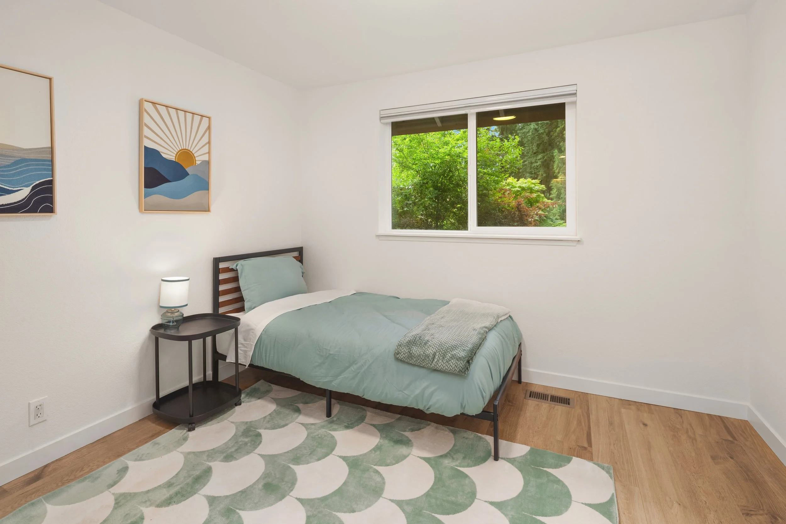 Third bedroom with twin size bed and plenty of extra space