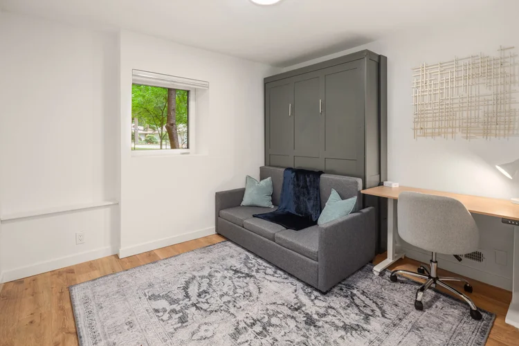 Fourth bedroom - set up as office with hidden Murphy bed. Includes motorized sit/stand desk, 32” 4K monitor