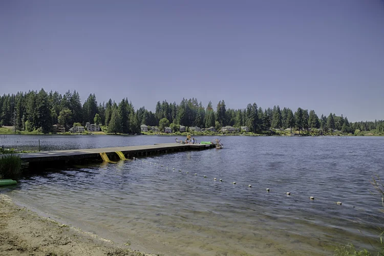 Cottage Lake Beach Club swim dock with yellow ladders and roped swim area