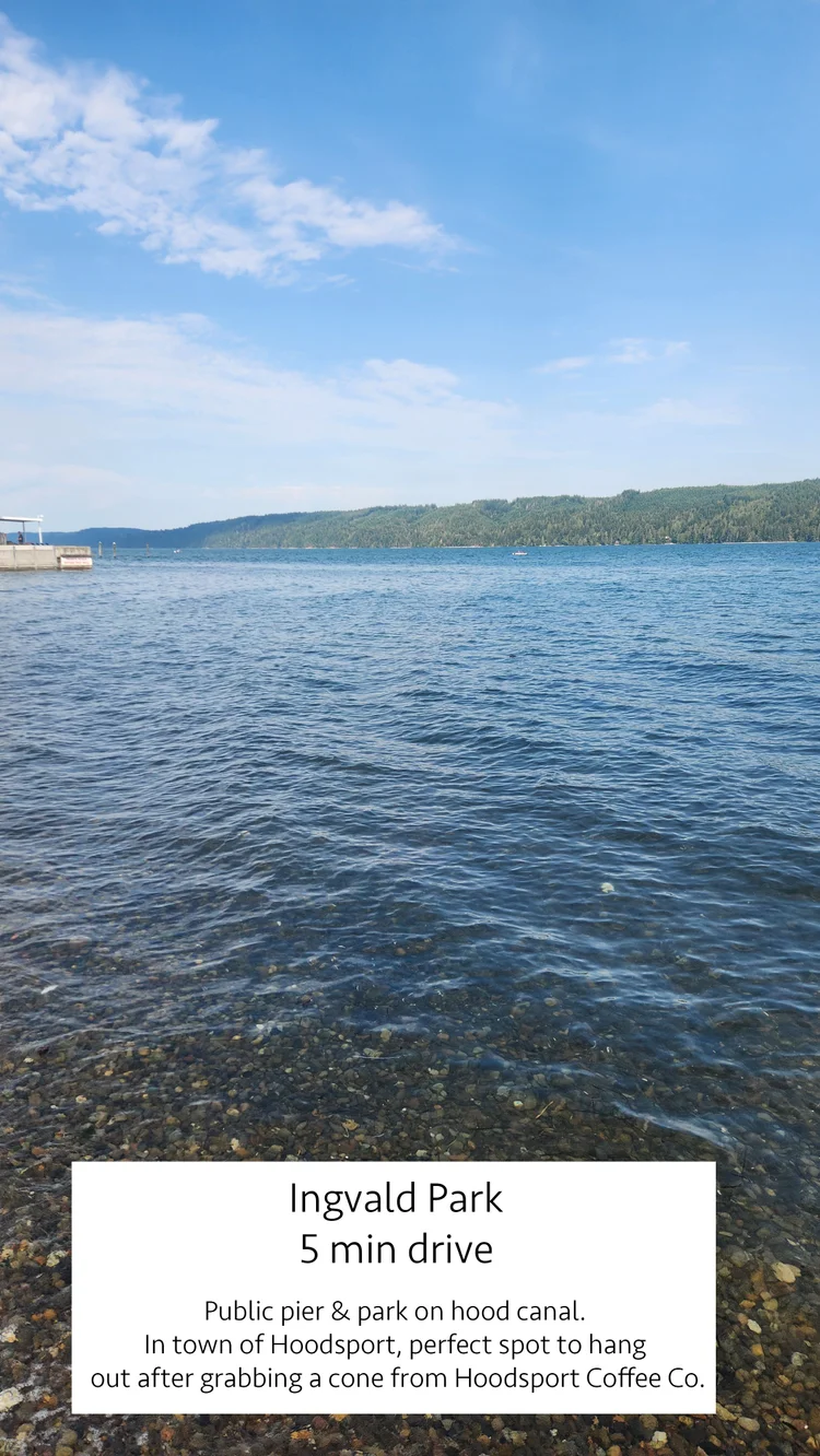 Clear Hood Canal water over a pebble beach at Ingvald Park, a 5 minute drive