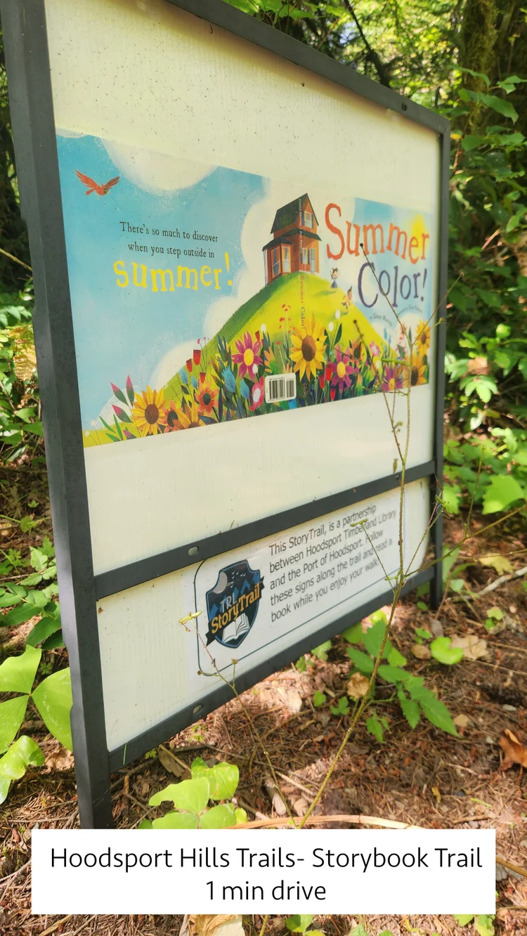 Summer Color book page sign on the Hoodsport Hills Storybook Trail, 1 minute drive