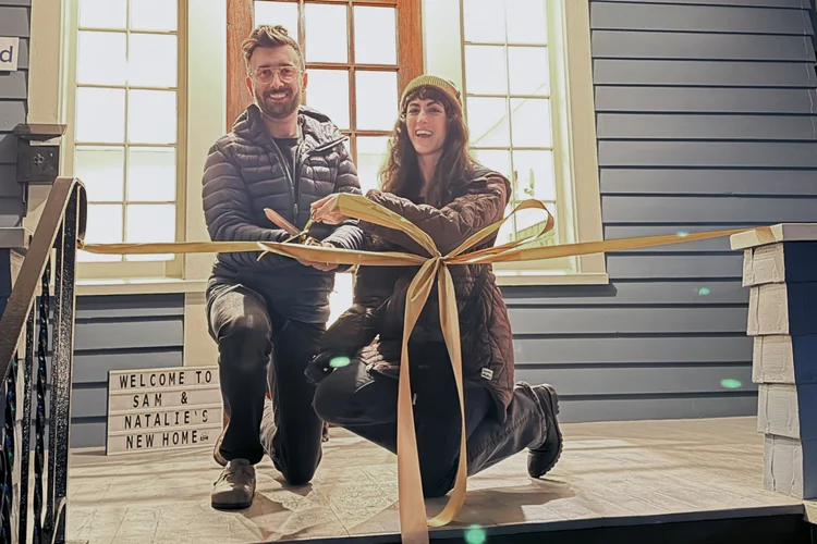 Seattle home buyers cutting the ribbon on their new home with Brian Huie