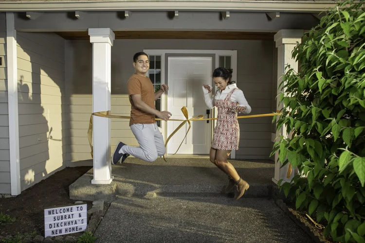 Seattle home buyers cutting the ribbon on their new home with Brian Huie