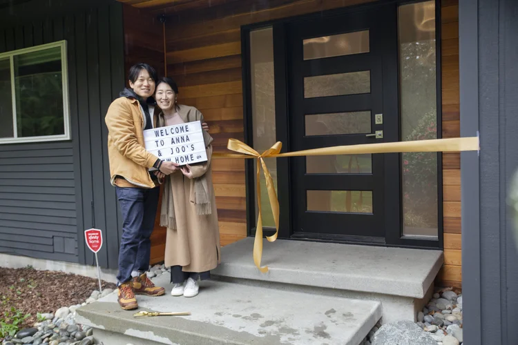 Seattle home buyers cutting the ribbon on their new home with Brian Huie
