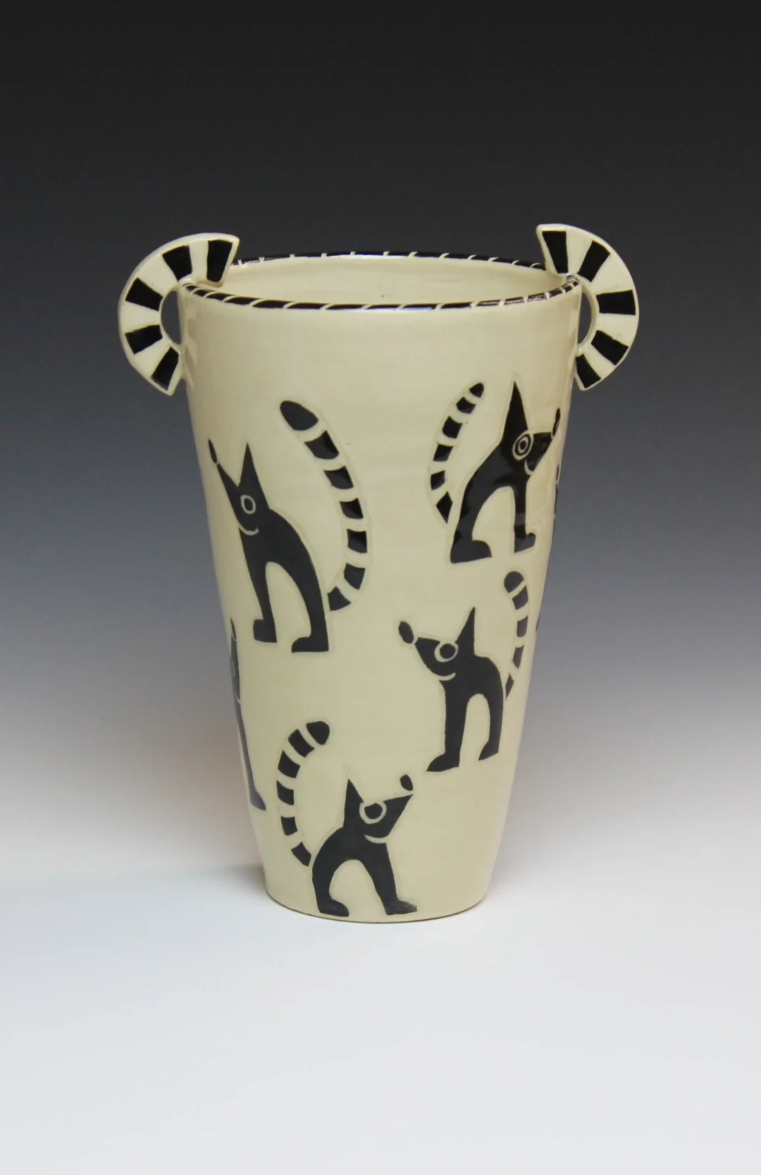 Vase with raccoon design